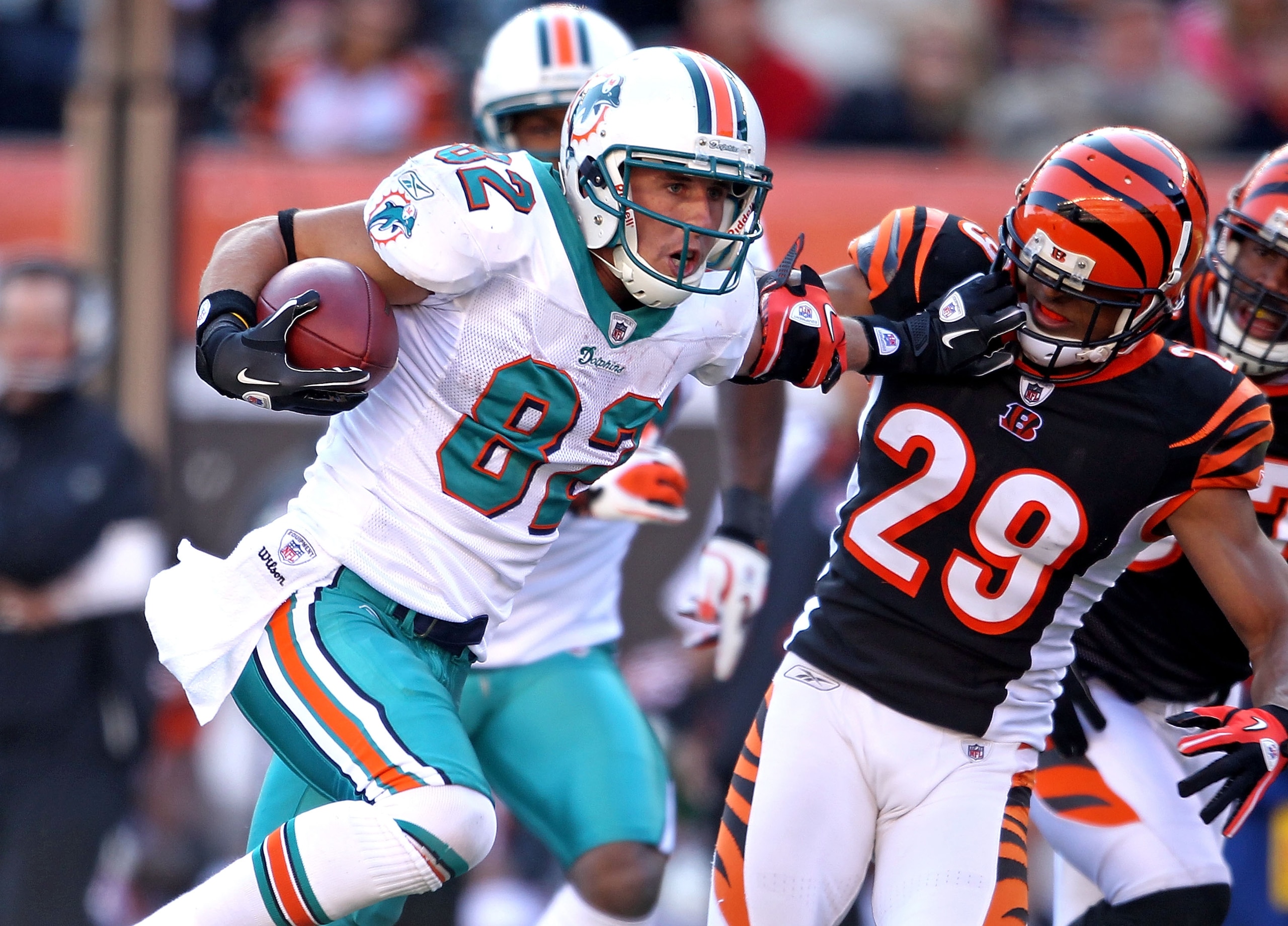 CINCINNATI - OCTOBER 31: Brian Hartline #82 of the Miami Dolphins runs with the ball while defended by Leon Hall #29 of the Cincinnati Bengals during the NFL game at Paul Brown Stadium on October 31, 2010 in Cincinnati, Ohio. (Photo by Andy Lyons/Getty CINCINNATI - OCTOBER 31: Brian Hartline #82 of the Miami Dolphins runs with the ball while defended by Leon Hall #29 of the Cincinnati Bengals during the NFL game at Paul Brown Stadium on October 31, 2010 in Cincinnati, Ohio. (Photo by Andy Lyons/Getty