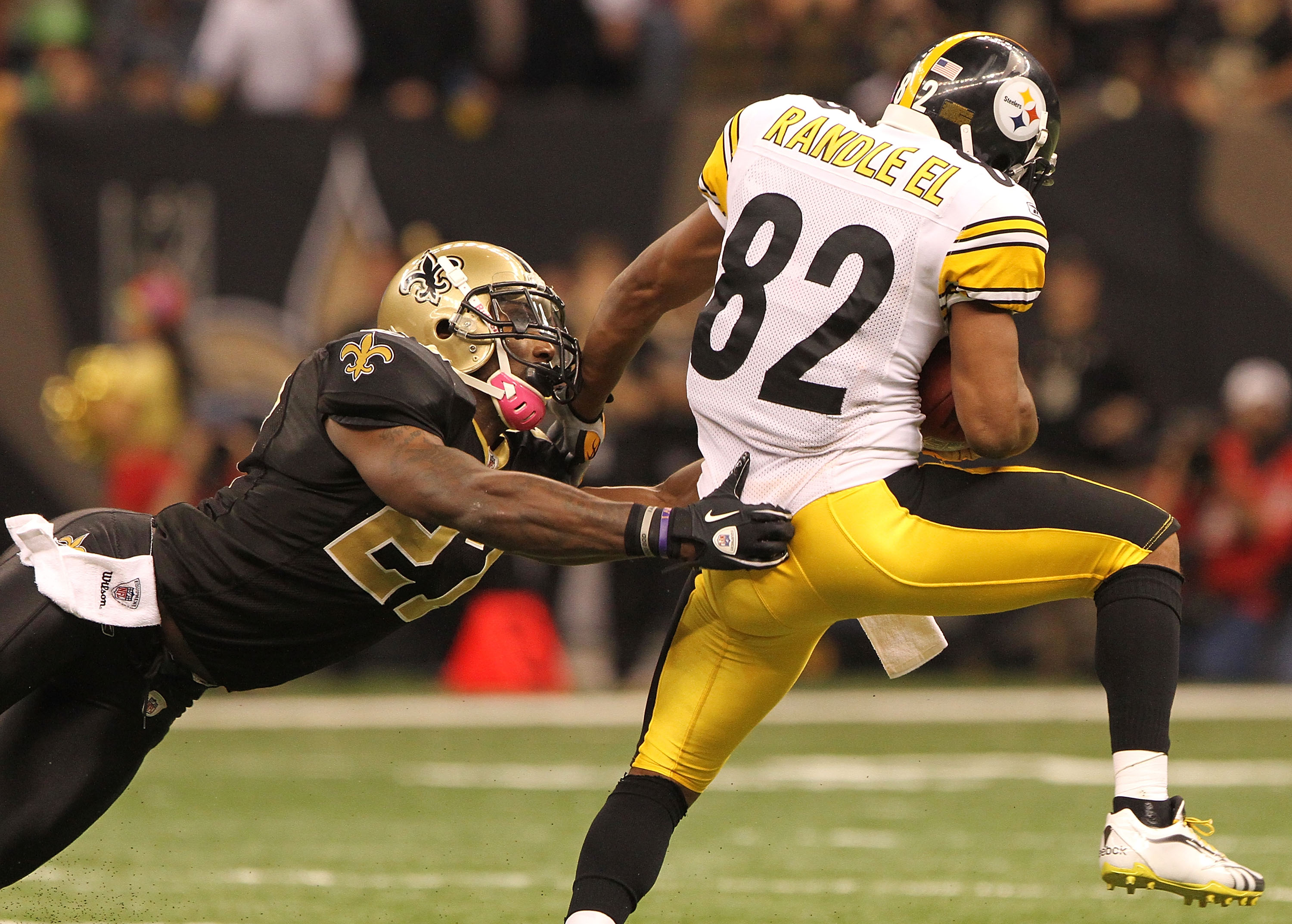 NEW ORLEANS - OCTOBER 31: Malcolm Jenkins #27 of the New Orleans Saints tackles Antwaan Randle El #82 of the Pittsburgh Steelers at the Louisiana Superdome on October 31, 2010 in New Orleans, Louisiana. (Photo by Matthew Sharpe/Getty Images)