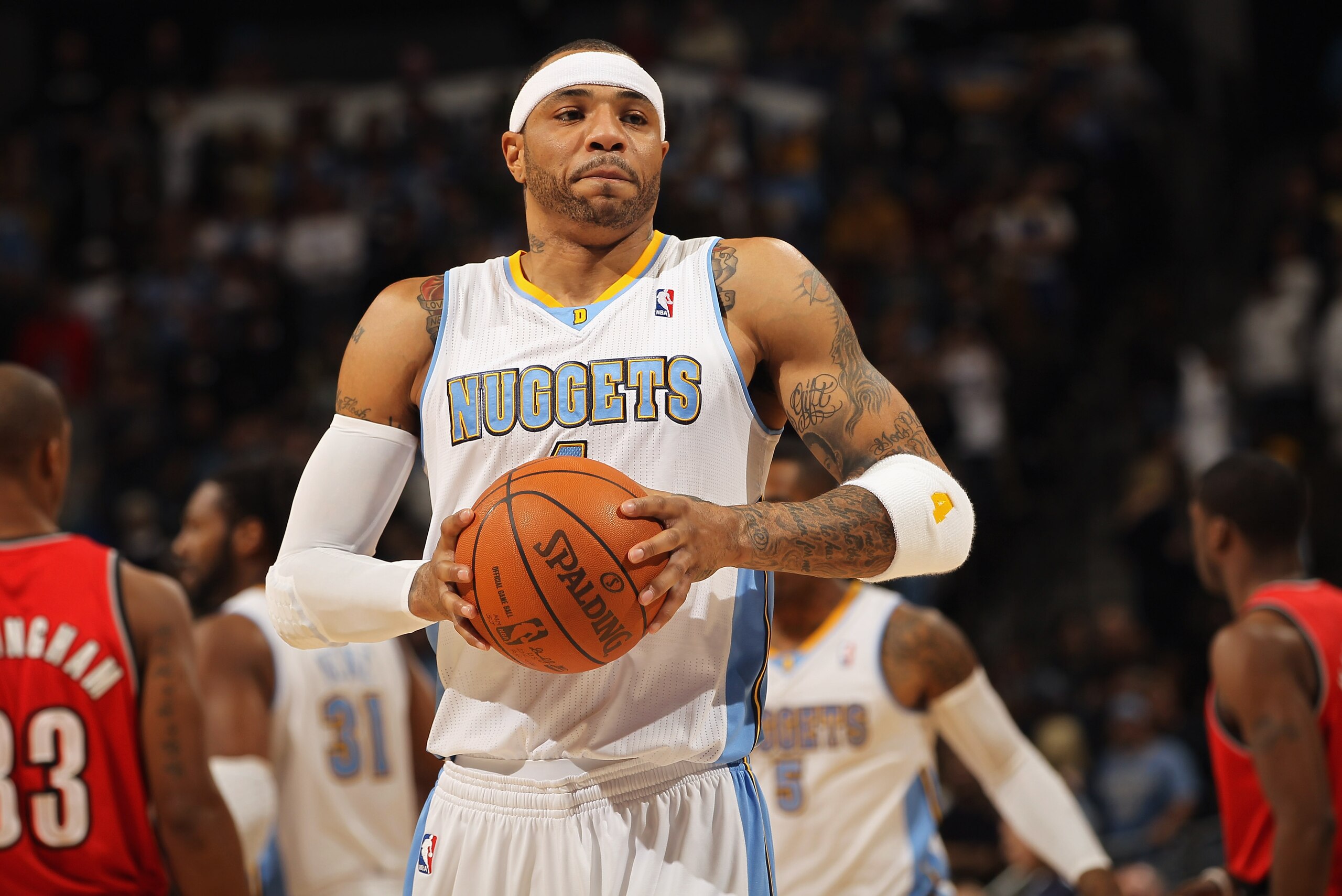 DENVER - DECEMBER 28:  Kenyon Martin #4 of the Denver Nuggets collects the ball against the Portland Trail Blazers at Pepsi Center on December 28, 2010 in Denver, Colorado. The Nuggets defeated the Blazers 95-77. NOTE TO USER: User expressly acknowledges