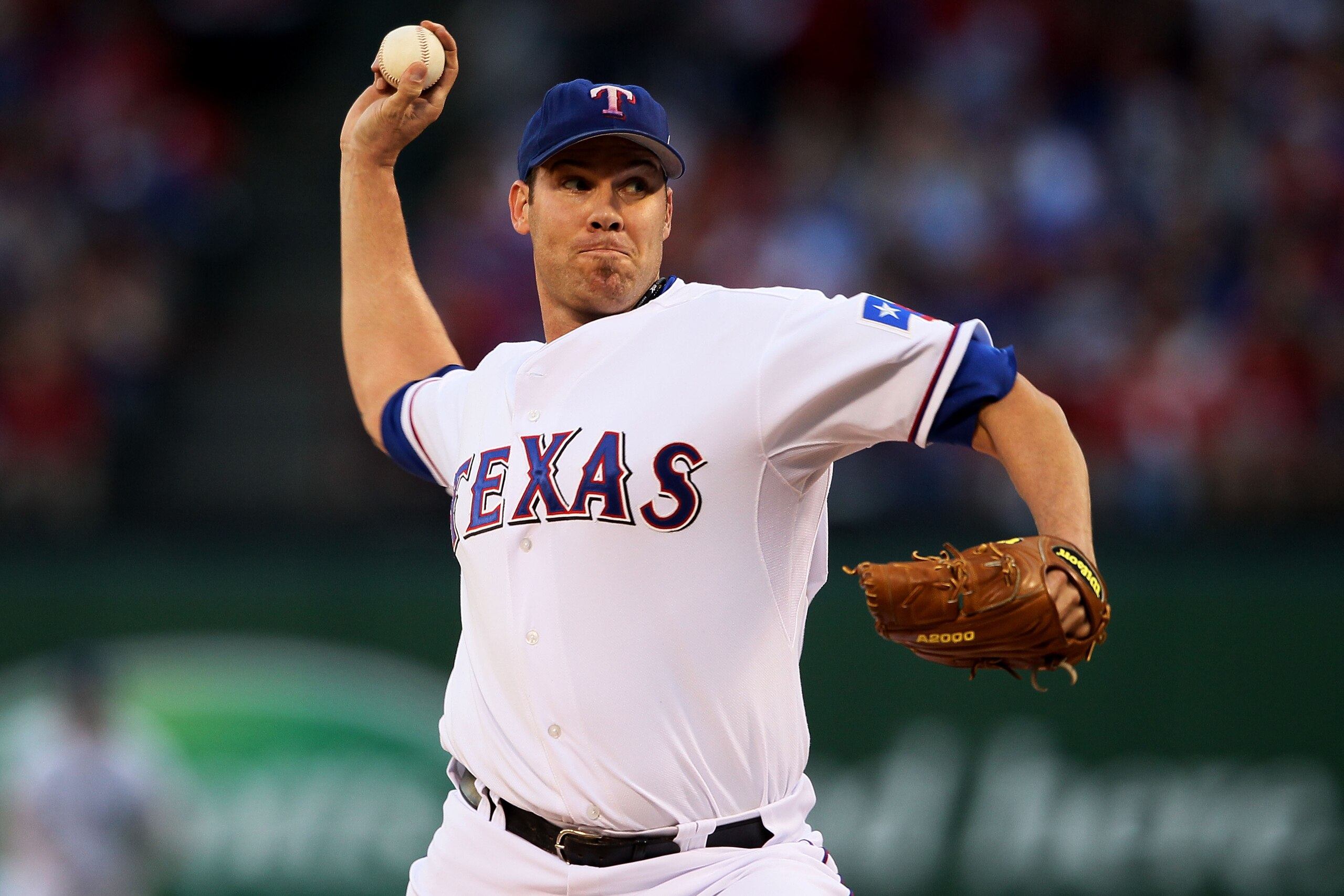 ARLINGTON, TX - OCTOBER 30: Starting pitcher Colby Lewis #48 of the Texas Rangers pitchs against the San Francisco Giants in Game Three of the 2010 MLB World Series at Rangers Ballpark in Arlington on October 30, 2010 in Arlington, Texas. (Photo by Elsa ARLINGTON, TX - OCTOBER 30: Starting pitcher Colby Lewis #48 of the Texas Rangers pitchs against the San Francisco Giants in Game Three of the 2010 MLB World Series at Rangers Ballpark in Arlington on October 30, 2010 in Arlington, Texas. (Photo by Elsa