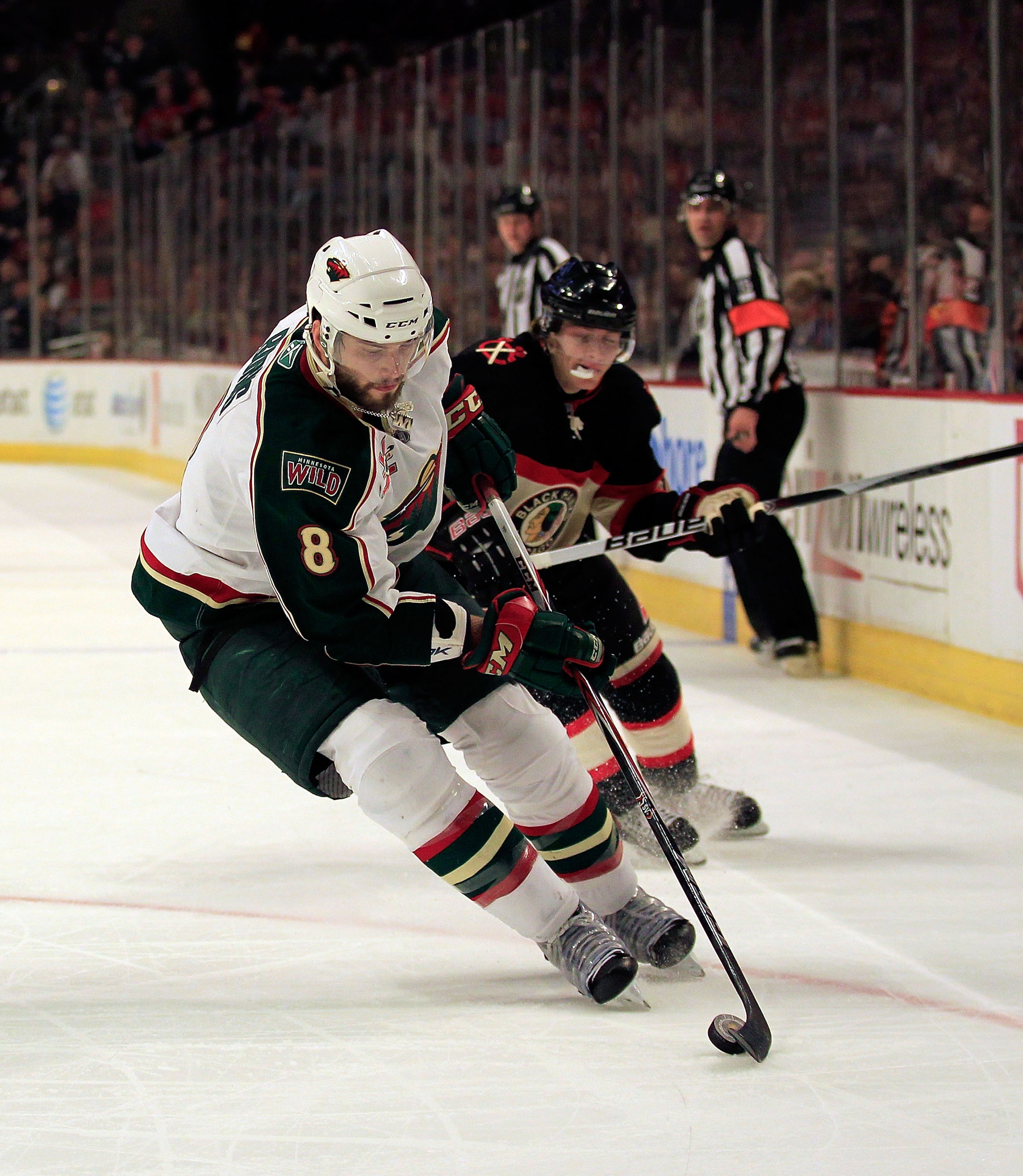 CHICAGO, IL - JANUARY 25: Brent Burns #8 of the Minnesota Wild controls the puck against Patrick Kane #88 of the Chicago Blackhawks at the United Center on January 25, 2011 in Chicago, Illinois. The Wild defeated the Blackhawks 4-2. (Photo by Jonathan Dan