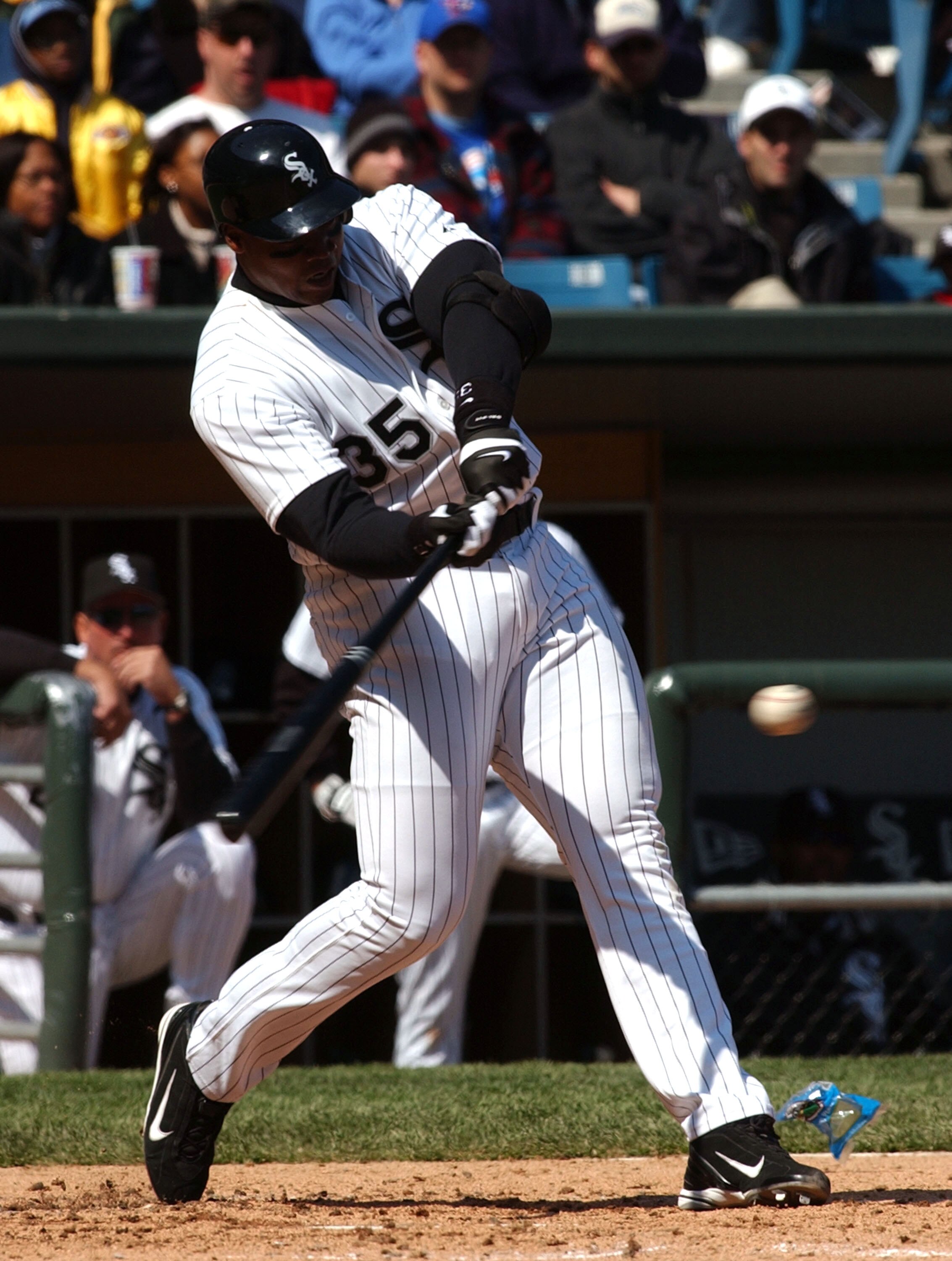 CHICAGO - MAY 2:  Designated hitter Frank Thomas #35 of the Chicago White Sox hits a solo home run in the fourth inning against the Toronto Blue Jays on May 2, 2004 at U.S. Cellular Field in Chicago, Illinois. The White Sox defeated the Blue Jays 3-2.  (P