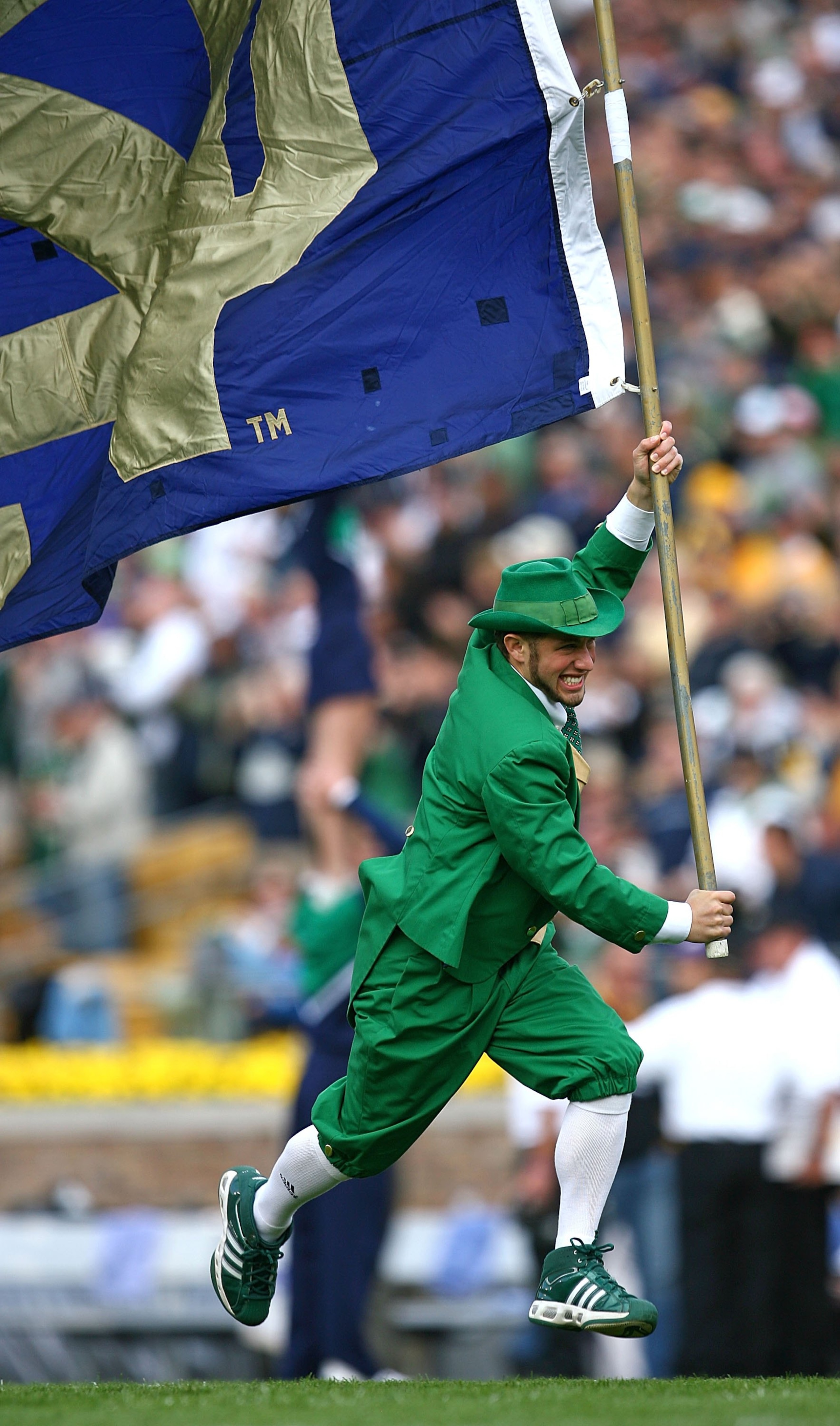 SOUTH BEND, IN - OCTOBER 03: The leprechaun mascot for the Notre Dame Fighting Irish runs onto the field with a flag before a game against the Washington Huskies on October 3, 2009 at Notre Dame Stadium in South Bend, Indiana. Notre Dame defeated Washingt