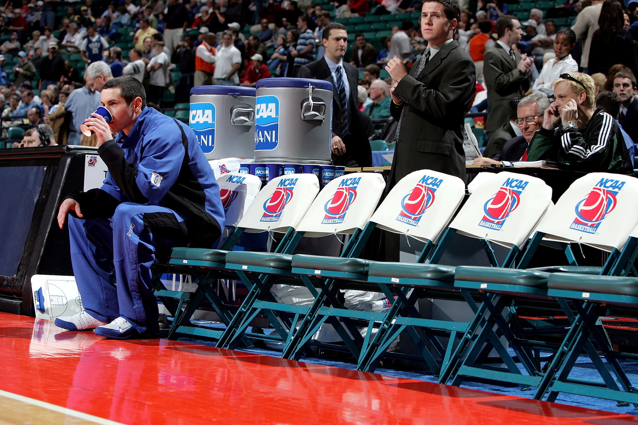 CHARLOTTE, NC - MARCH 18:  J.J. Redick #4 of the Duke Blue Devils sits on the bench alone during warm-ups before their first round NCAA Tournament game against the Delaware State Hornets at the Charlotte Coliseum on March 18, 2005 in Charlotte, North Caro