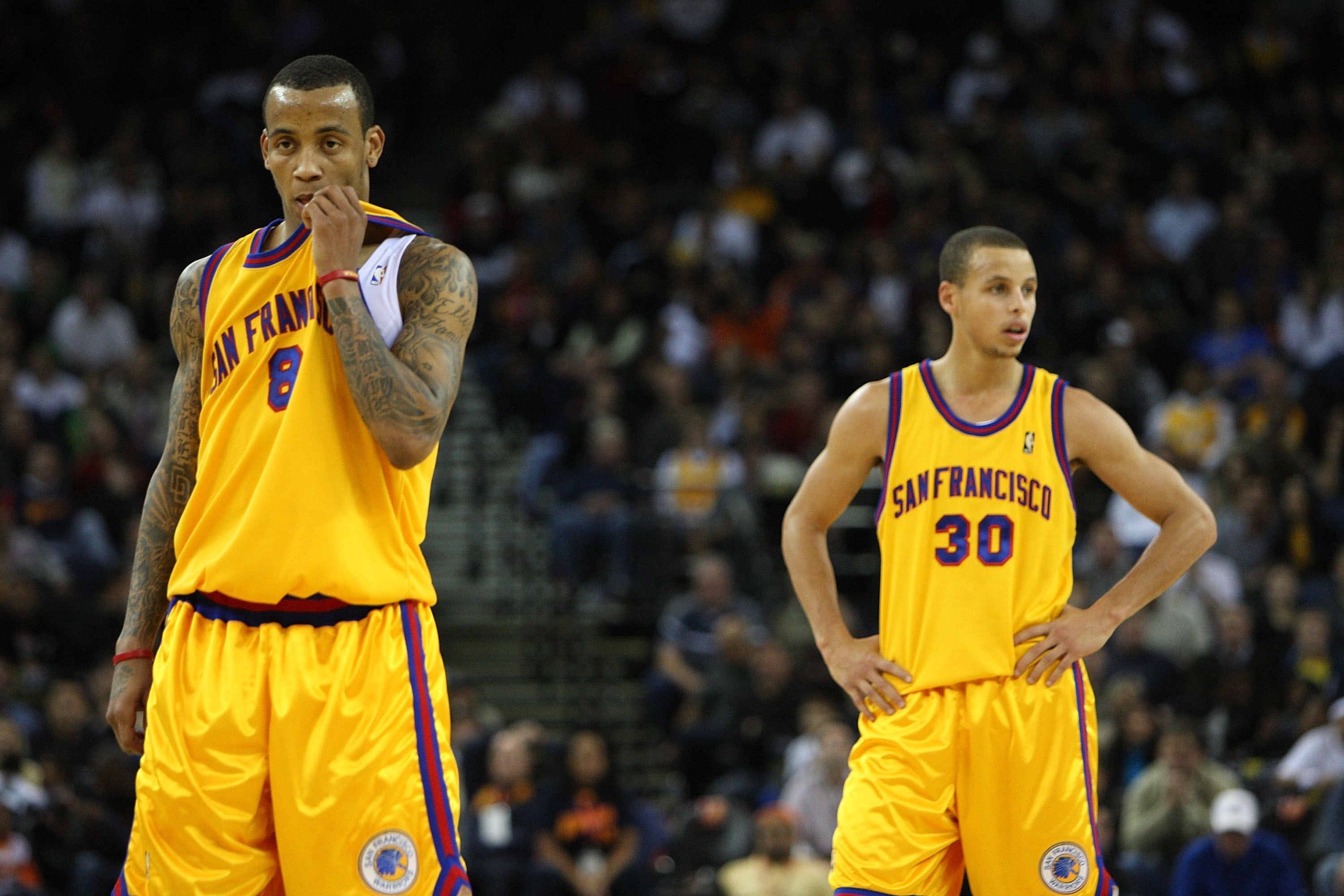 OAKLAND, CA - DECEMBER 03:  Stephen Curry #30 and Monta Ellis #8 of the Golden State Warriors look on near the end of the game against the Houston Rockets during an NBA game at Oracle Arena on December 3, 2009 in Oakland, California. NOTE TO USER: User ex
