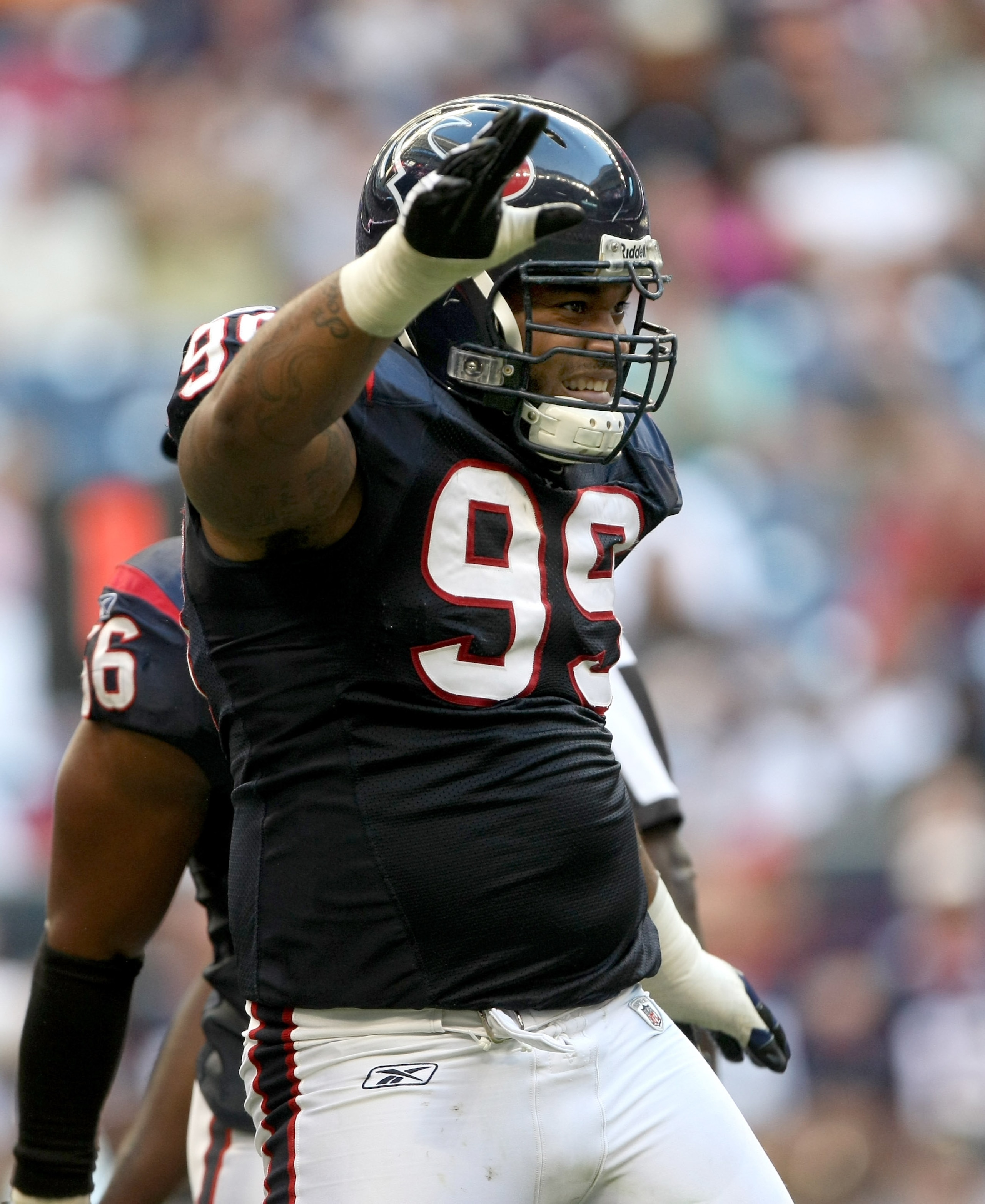 HOUSTON - OCTOBER 26:  Defensive tackle Travis Johnson #99 of the Houston Texans celebrates after making a sack against the Cincinnati Bengals on October 26, 2008 at Reliant Stadium in Houston, Texas. The Texans won 35-6.  (Photo by Stephen Dunn/Getty Ima
