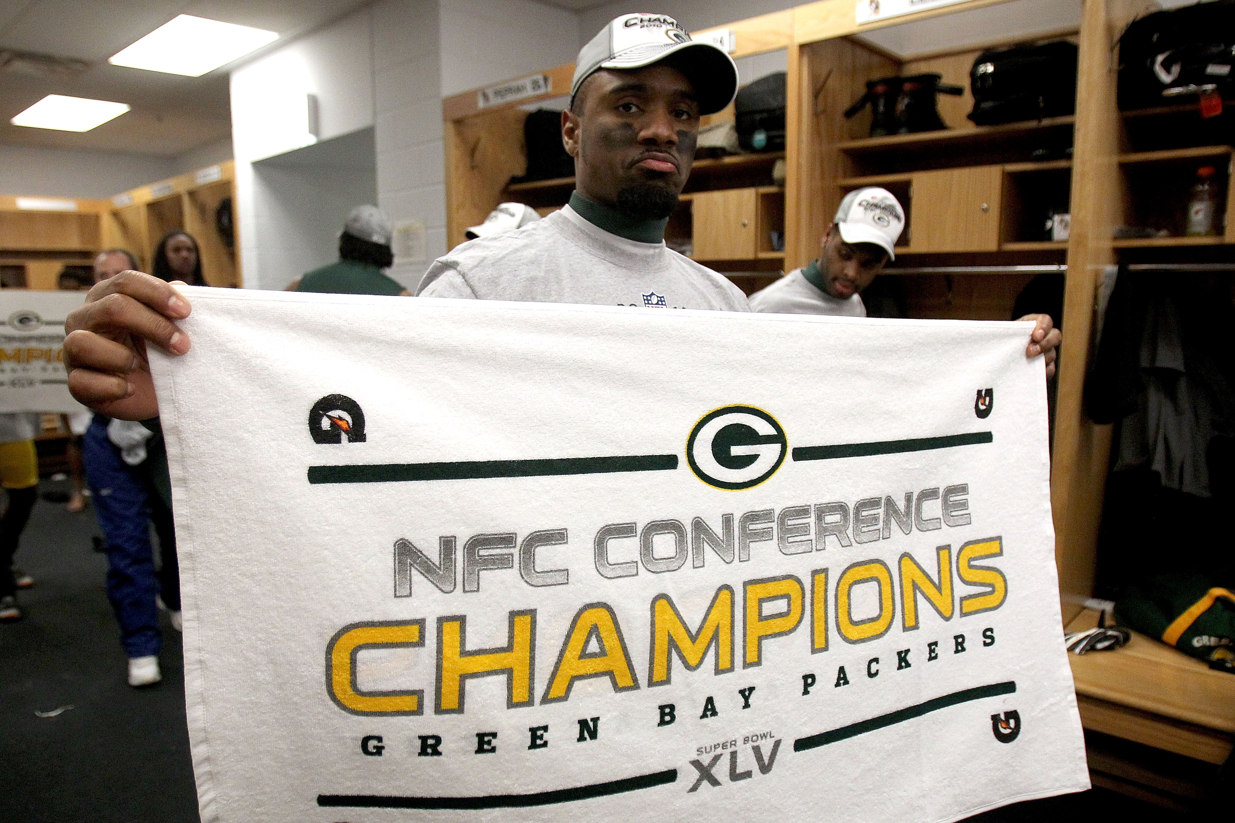 CHICAGO, IL - JANUARY 23:  Charles Woodson #21 of the Green Bay Packers celebrates in the locker room after the Packers 21-14 victory against the Chicago Bears in the NFC Championship Game at Soldier Field on January 23, 2011 in Chicago, Illinois.  (Photo