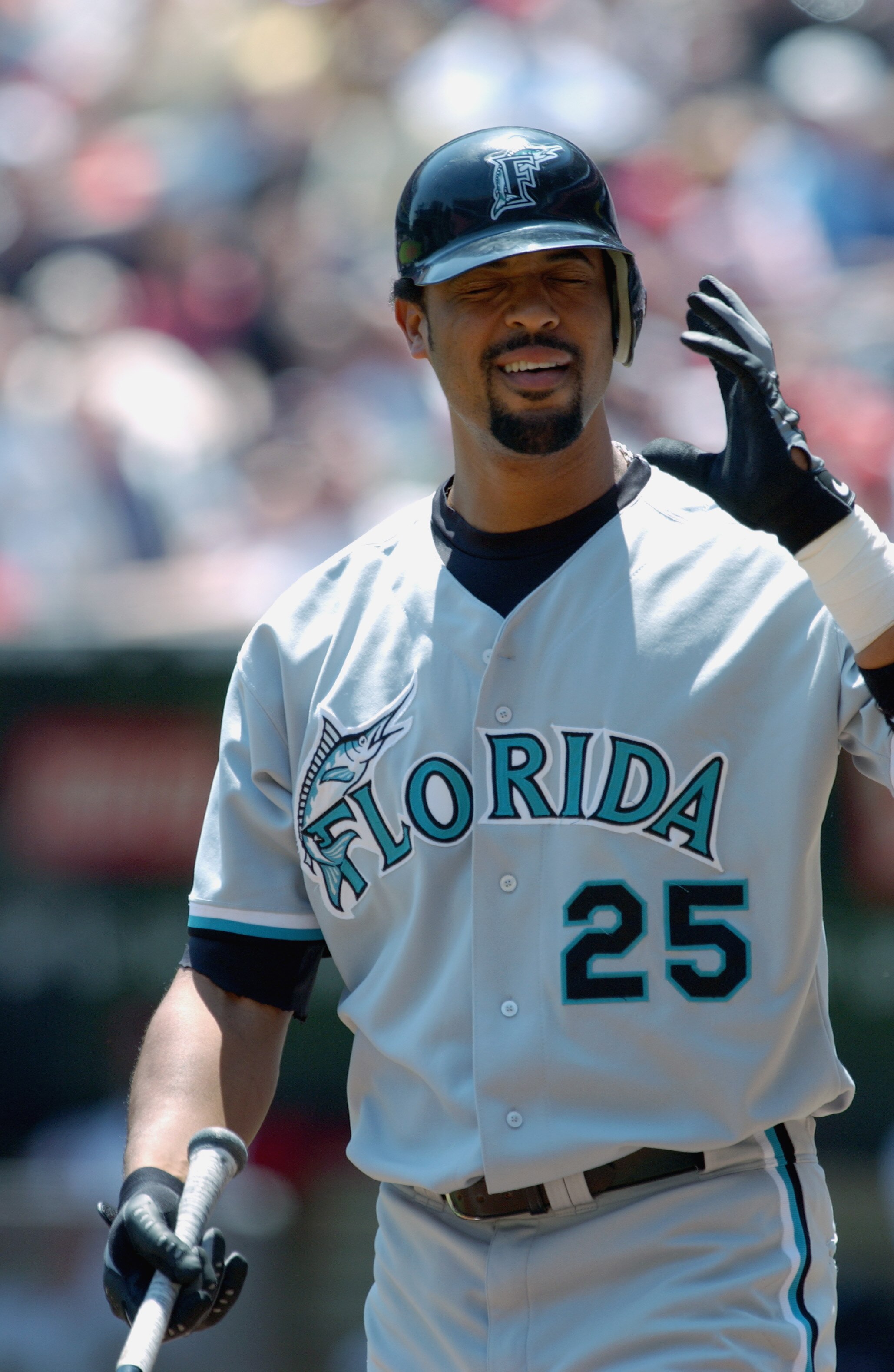 CINCINNATI - MAY 23:  First baseman Derrek Lee #25 of the Florida Marlins blinks at the plate during the MLB game against the Cincinnati Reds at Cinergy Field in Cincinnatti, Ohio on May 23, 2002. The Marlins defeated the Reds 8-4. (Photo by Matthew Stock