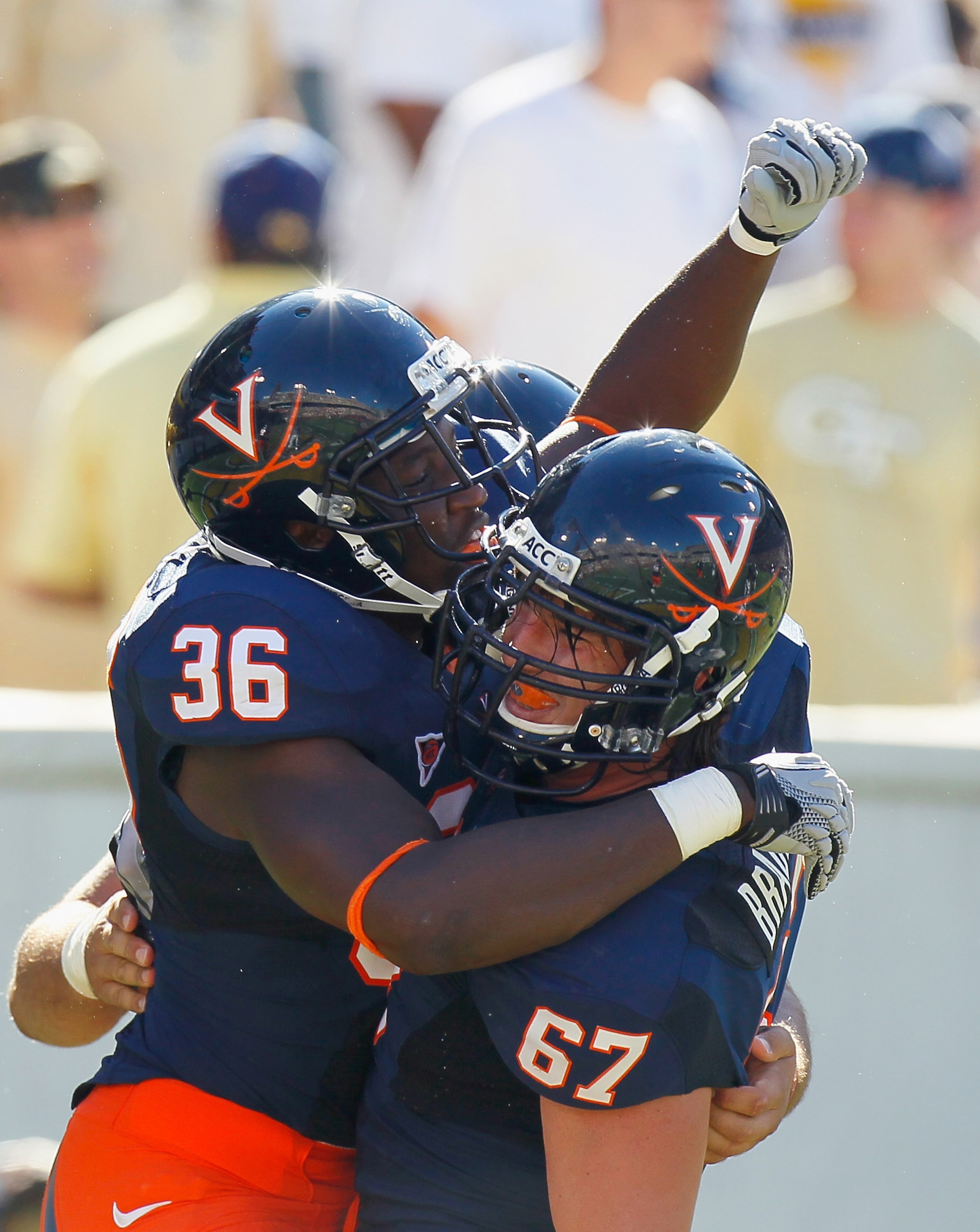 ATLANTA - OCTOBER 09:  Max Milien #36  of the Virginia Cavaliers celebrates his touchdown against the Georgia Tech Yellow Jackets with Landon Bradley #67 at Bobby Dodd Stadium on October 9, 2010 in Atlanta, Georgia.  (Photo by Kevin C. Cox/Getty Images)