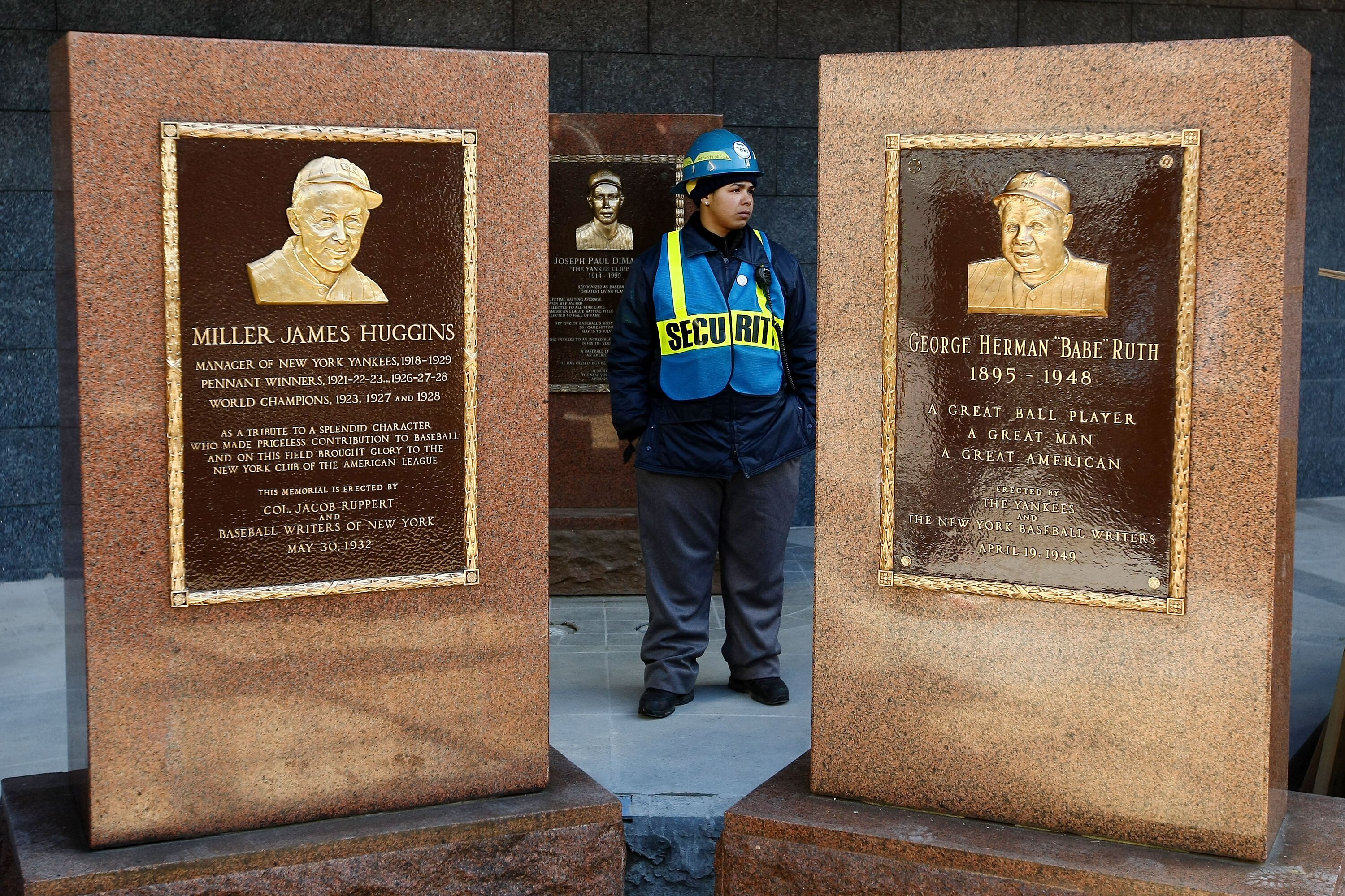 NEW YORK - FEBRUARY 25: Security stands guard over the  Babe Ruth Memorial stone (R) after it was installed in  Monument Park February 25, 2009 inside the new Yankee Stadium in the Bronx Borough of New York City.  (Photo by Chris McGrath/Getty Images)