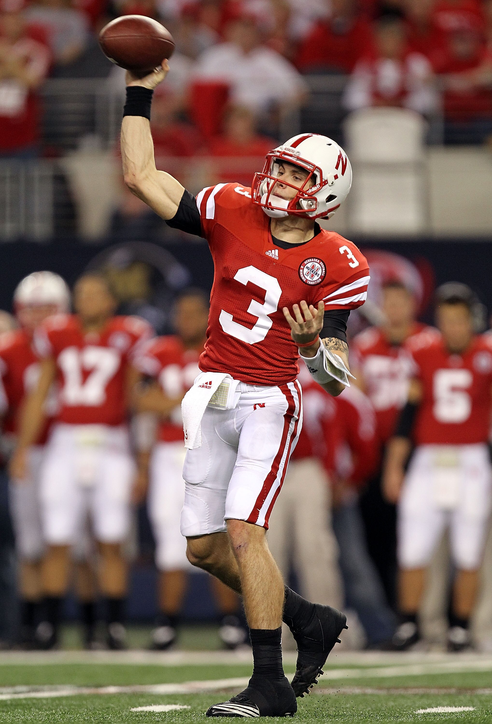 ARLINGTON, TX - DECEMBER 04:  Quarterback Taylor Martinez #3 of the Nebraska Cornhuskers drops back to pass against the Oklahoma Sooners during the Big 12 Championship at Cowboys Stadium on December 4, 2010 in Arlington, Texas.  (Photo by Ronald Martinez/