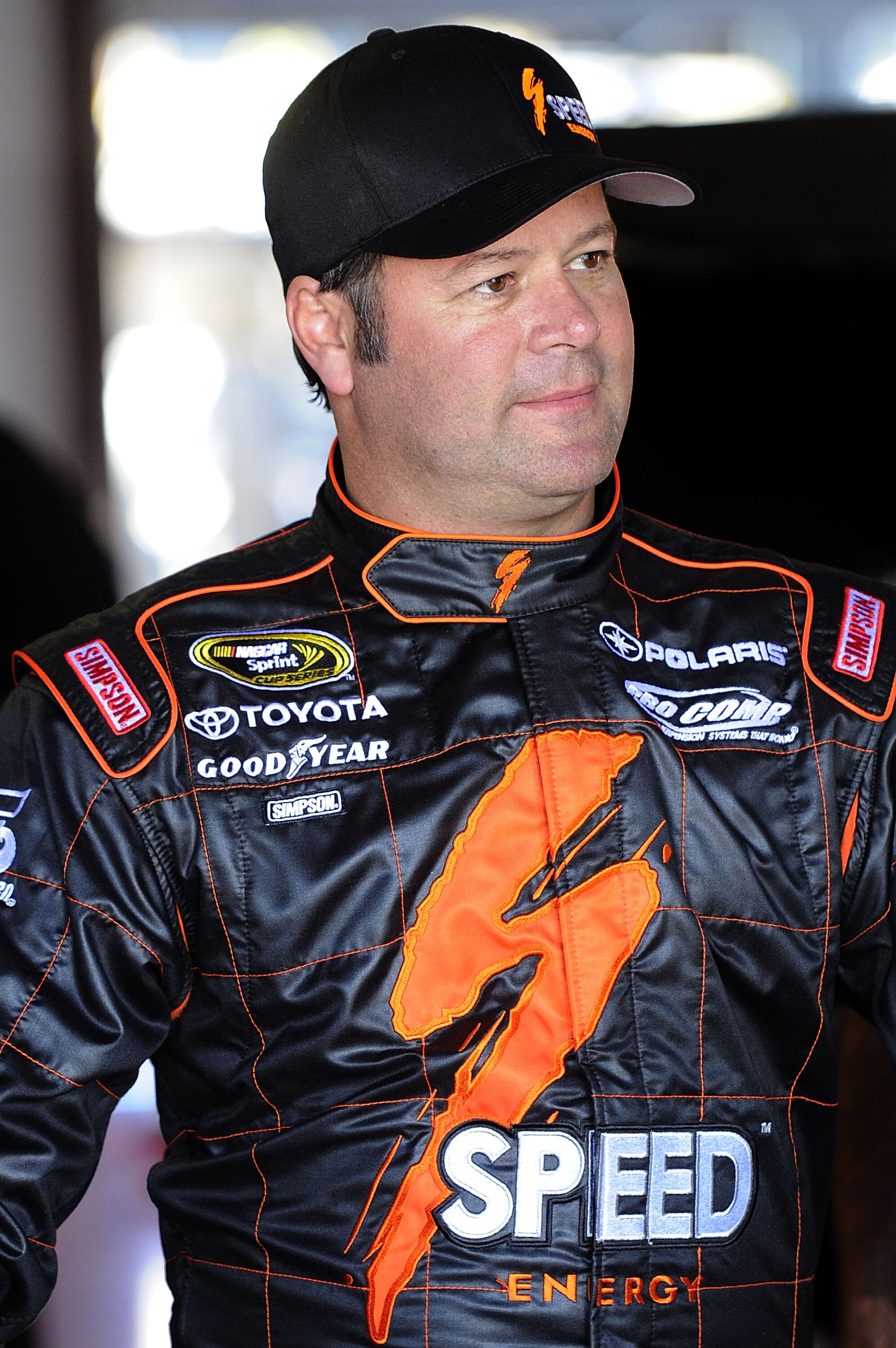 TALLADEGA, AL - OCTOBER 29:  Robby Gordon, driver of the #7 Speed Toyota, stands in the garage during practice for the NASCAR Sprint Cup Series AMP Energy Juice 500 at Talladega Superspeedway on October 29, 2010 in Talladega, Alabama.  (Photo by John Harr
