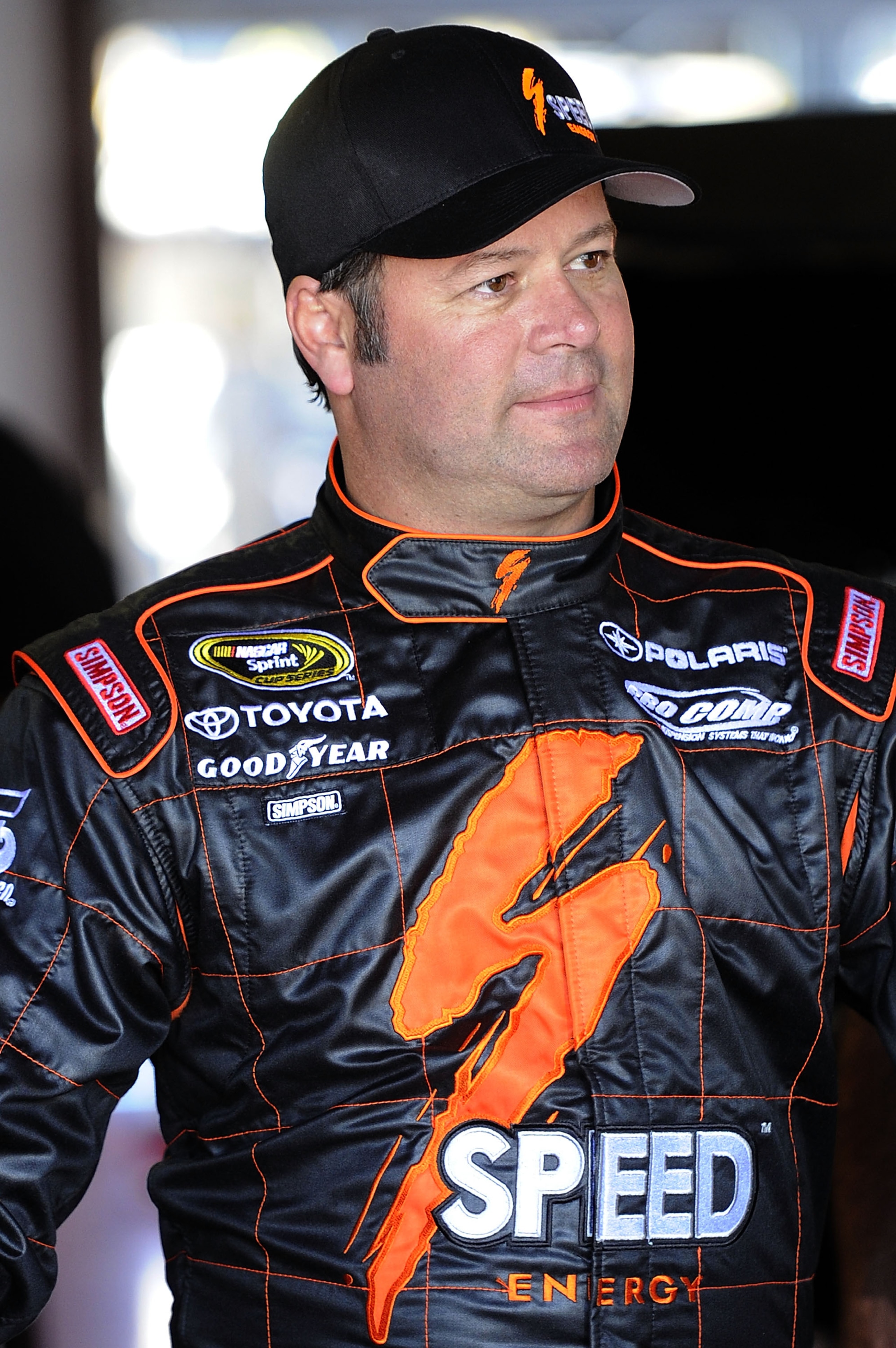 TALLADEGA, AL - OCTOBER 29:  Robby Gordon, driver of the #7 Speed Toyota, stands in the garage during practice for the NASCAR Sprint Cup Series AMP Energy Juice 500 at Talladega Superspeedway on October 29, 2010 in Talladega, Alabama.  (Photo by John Harr