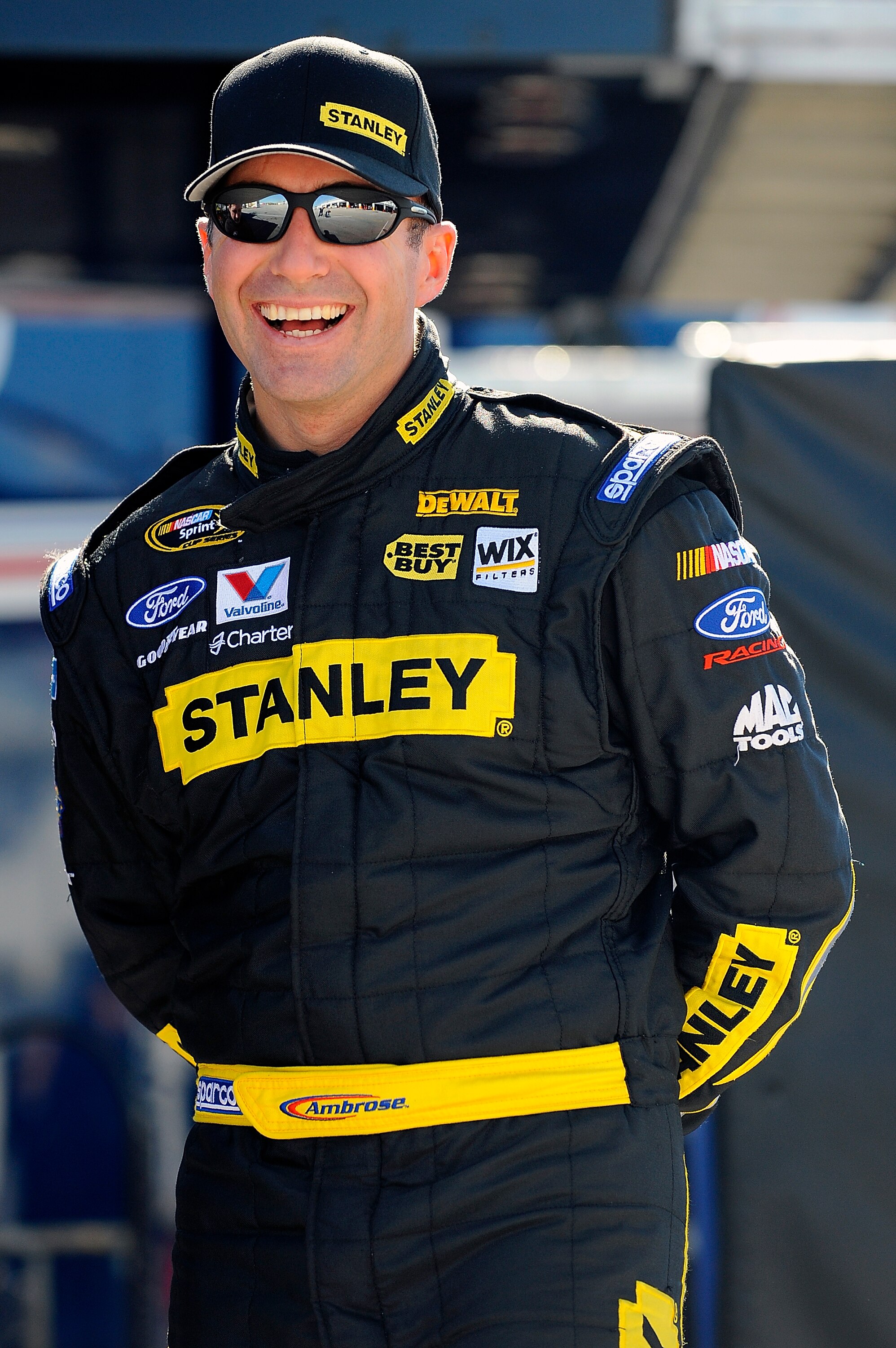 DAYTONA BEACH, FL - JANUARY 22:  Marcos Ambrose, driver of the #9 Stanley Ford, shares a laugh in garage during testing at Daytona International Speedway on January 22, 2011 in Daytona Beach, Florida.  (Photo by Jared C. Tilton/Getty Images for NASCAR)