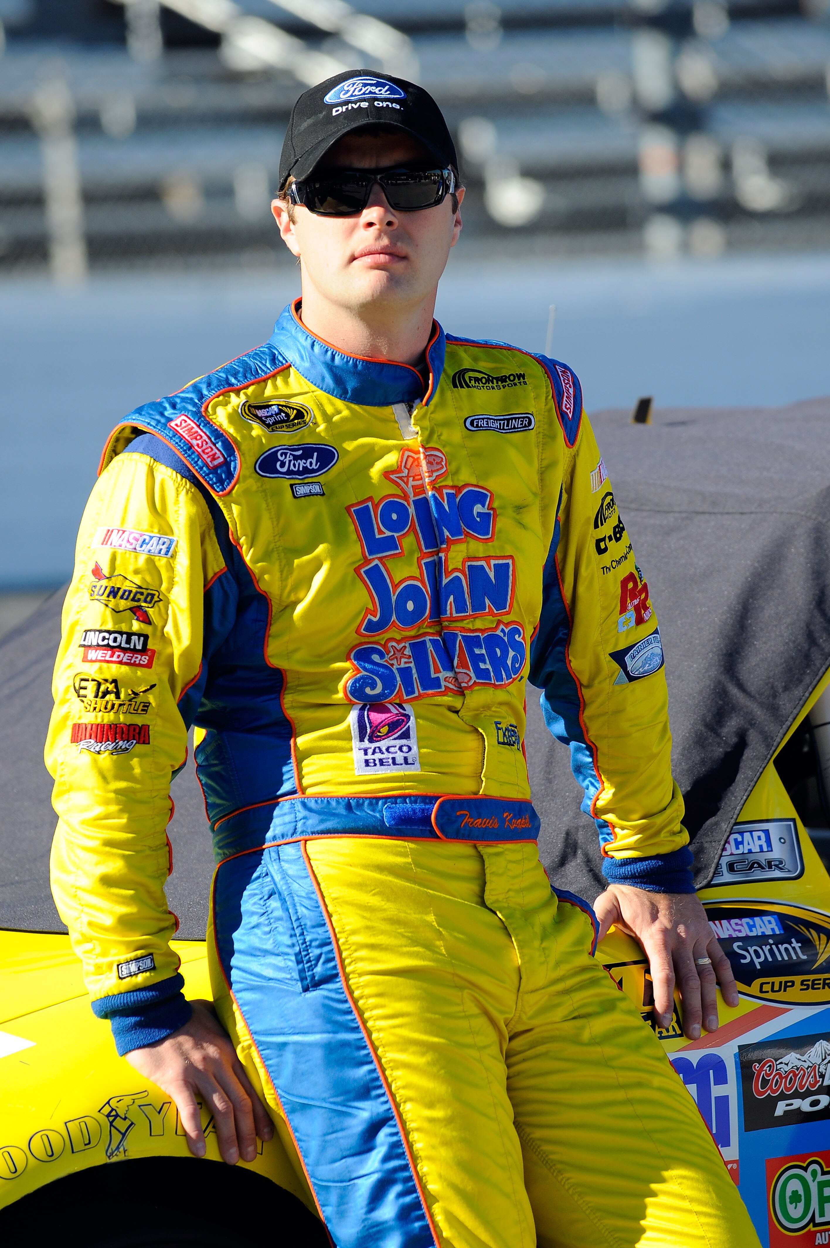 MARTINSVILLE, VA - OCTOBER 22:  Travis Kvapil, driver of the #38 Long John Silver's Ford, stands on pit road during qualifying for the NASCAR Sprint Cup Series TUMS Fast Relief 500 at Martinsville Speedway on October 22, 2010 in Martinsville, Virginia.  (