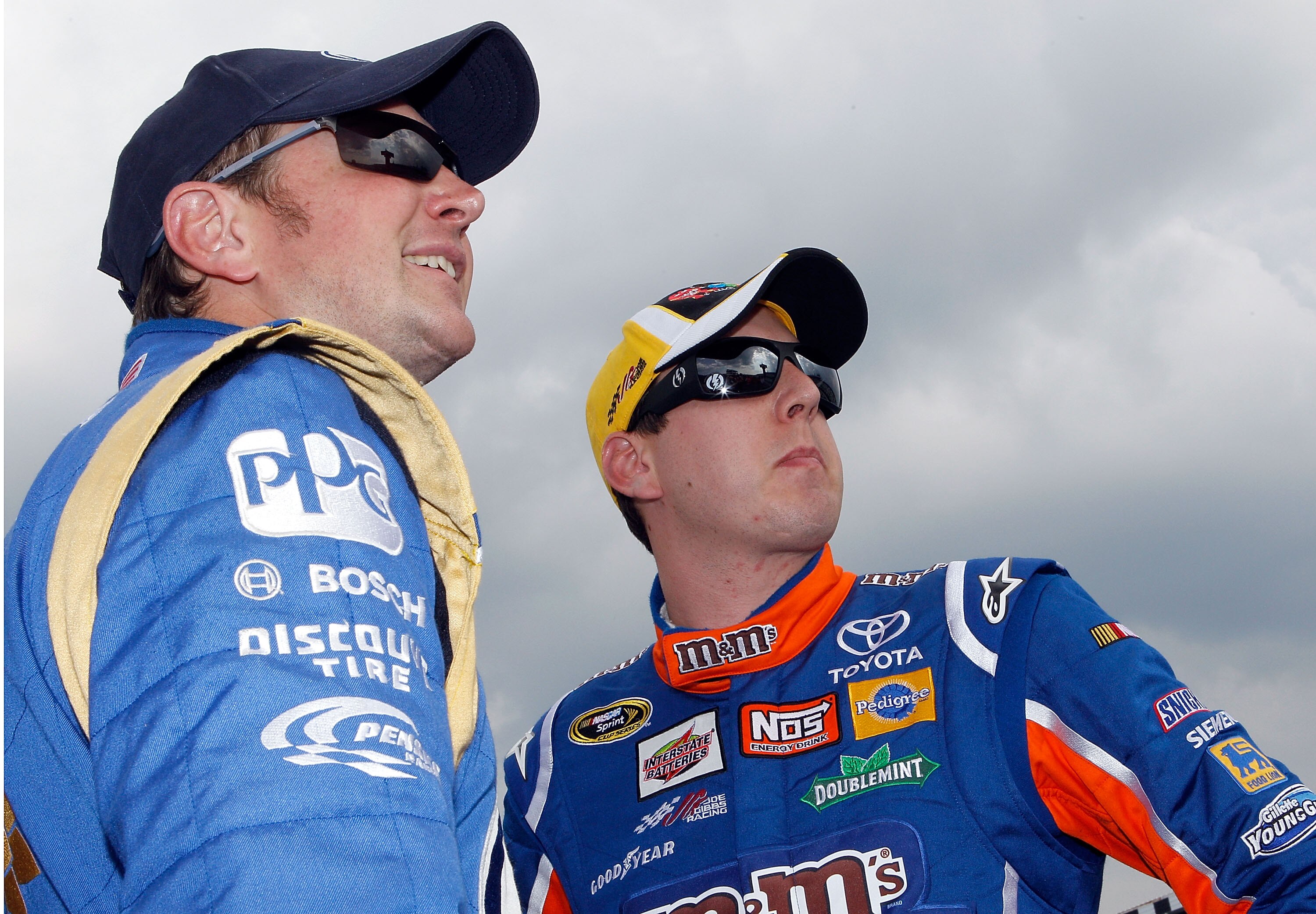 LONG POND, PA - JUNE 04:  Kurt Busch (L), driver of the #2 Miller Lite/Vortex Dodge, stands with his brother Kyle Busch (R), driver of the #18 M&M's Pretzel Toyota, on the grid during qualifying for the NASCAR Sprint Cup Series Gillette Fusion ProGlide 50