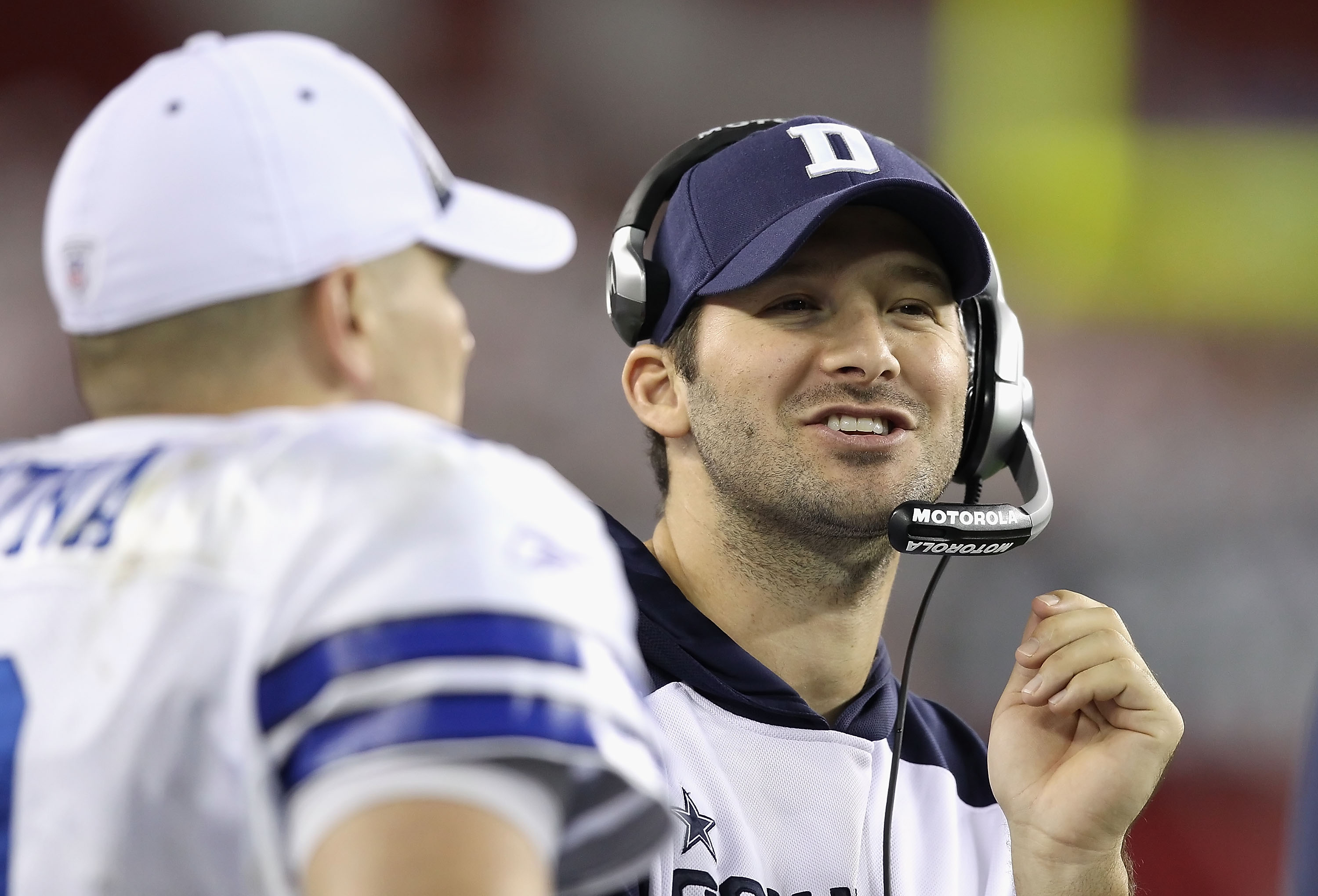 GLENDALE, AZ - DECEMBER 25:  Quarterbacks Tony Romo and Jon Kitna #3 of the Dallas Cowboys talk on the sideline during the NFL game against the Arizona Cardinals at the University of Phoenix Stadium on December 25, 2010 in Glendale, Arizona. The Cardinals