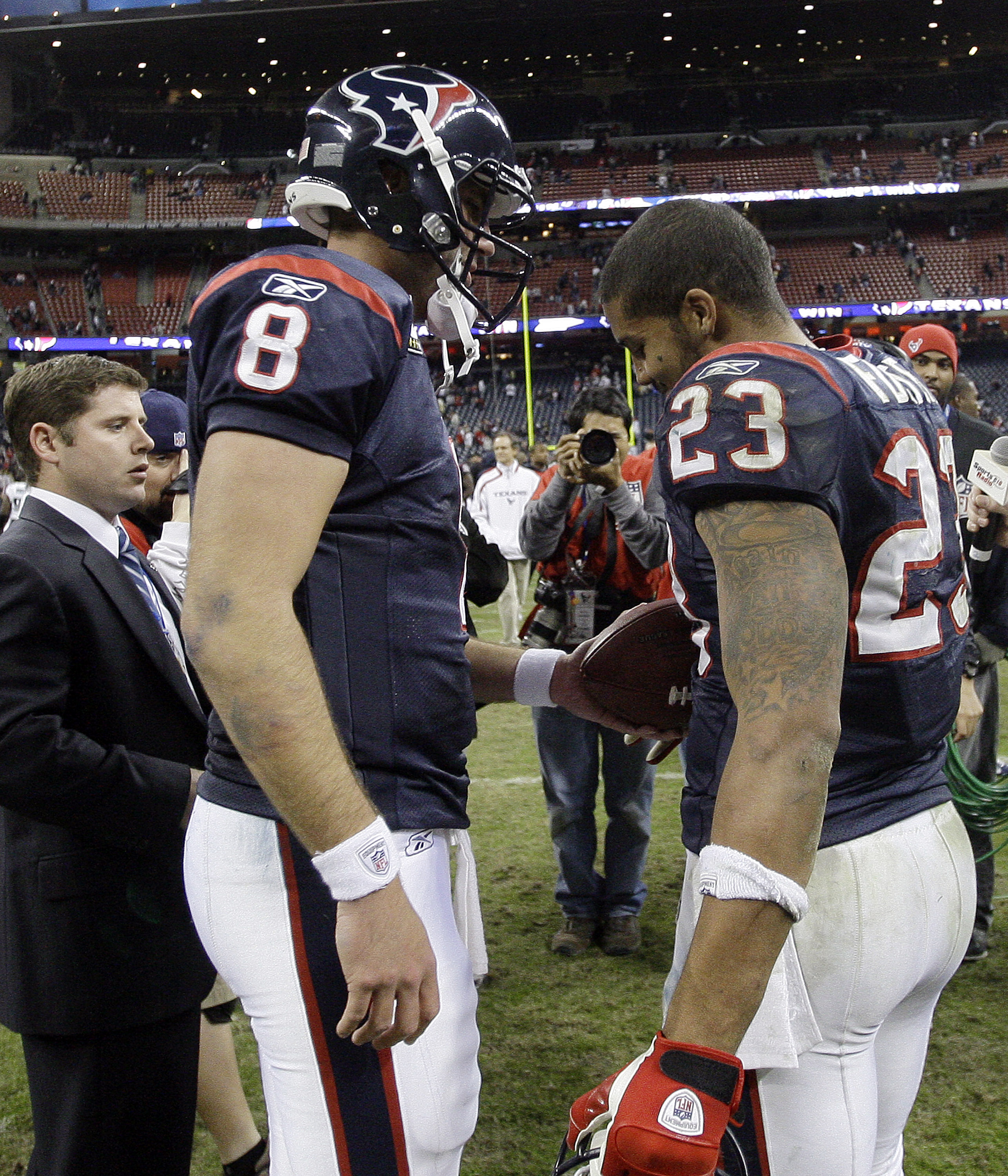 HOUSTON - JANUARY 02:  Quarterback Matt Schaub #8 of the Houston Texans hands running back Arian Foster #23 the game ball after Houston defeated the Jacksonville Jaguars 34-17 at Reliant Stadium on January 2, 2011 in Houston, Texas.  (Photo by Bob Levey/G
