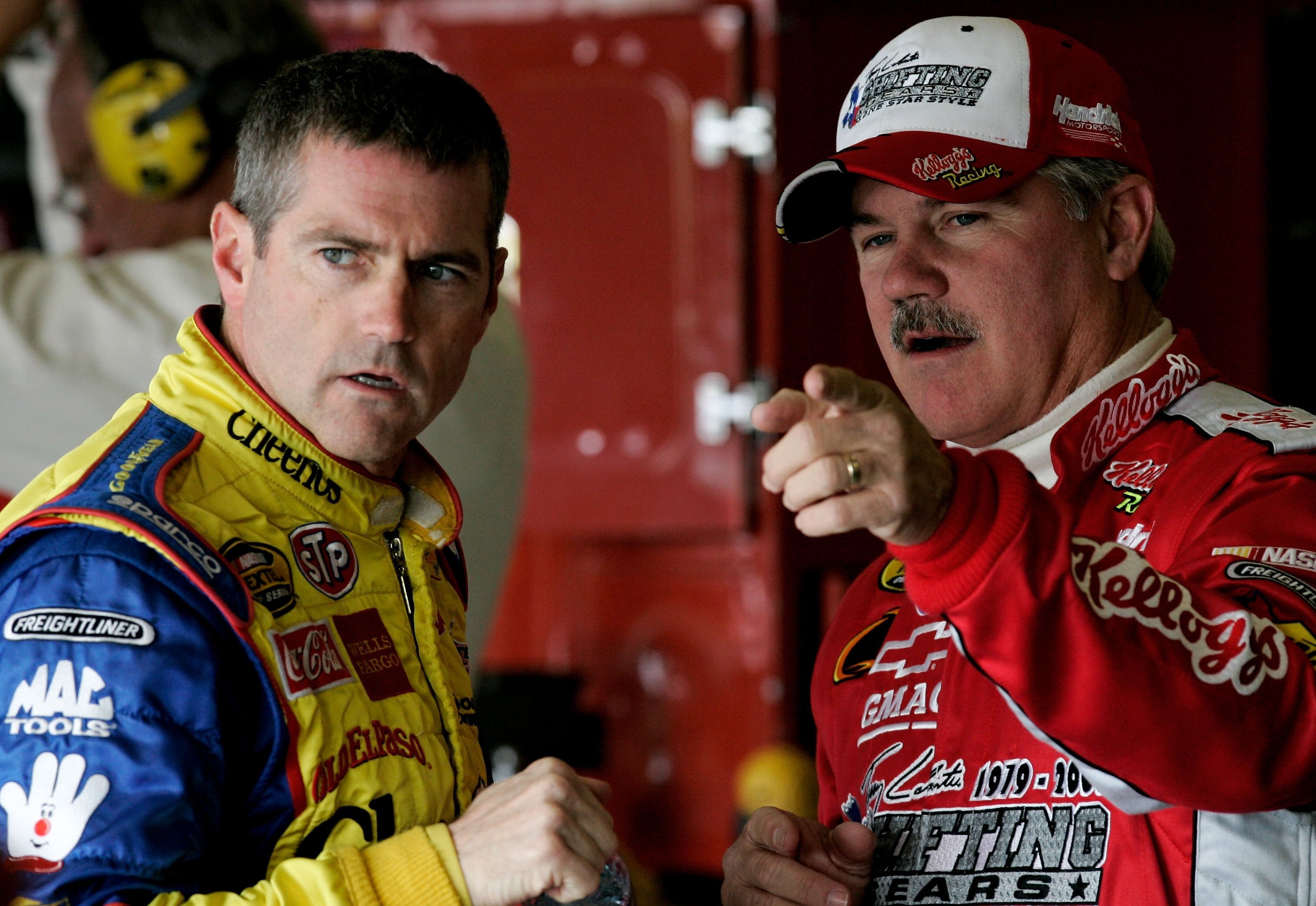 FORT WORTH, TX - NOVEMBER 04:  Bobby Labonte, driver of the #43 Cheerios/Betty Crocker Dodge, talks with his brother Terry labonte, driver of the #44 Kellogg's Chevrolet, during practice for the NASCAR Nextel Cup Series Dickies 500, on November 4, 2006 at
