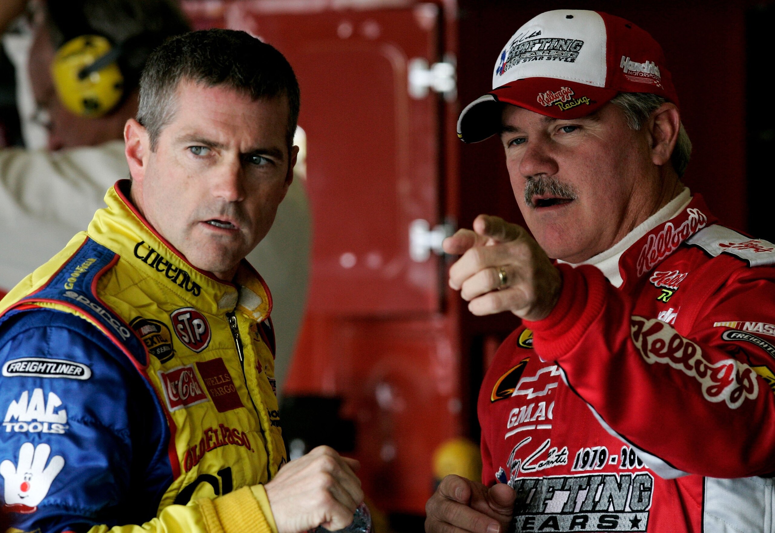 FORT WORTH, TX - NOVEMBER 04:  Bobby Labonte, driver of the #43 Cheerios/Betty Crocker Dodge, talks with his brother Terry labonte, driver of the #44 Kellogg's Chevrolet, during practice for the NASCAR Nextel Cup Series Dickies 500, on November 4, 2006 at