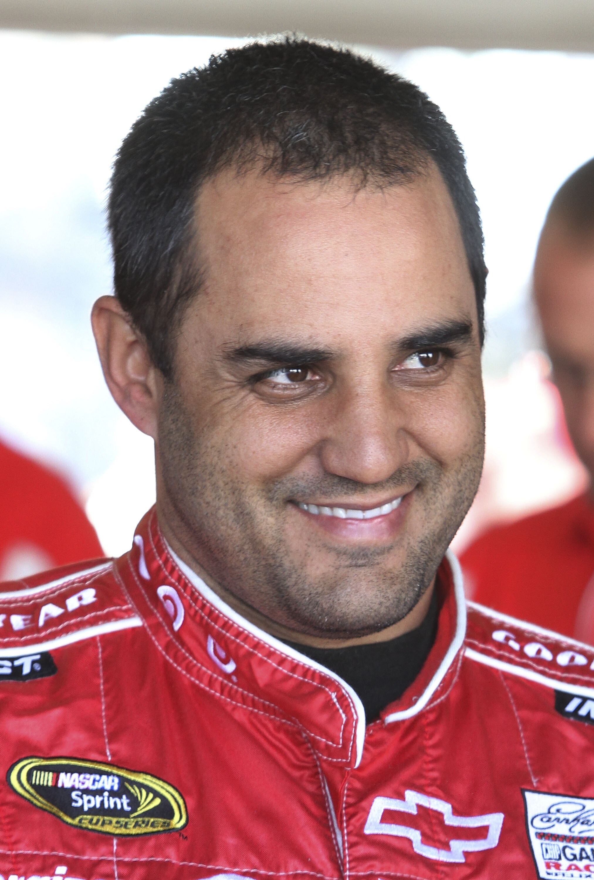 DAYTONA BEACH, FL - JANUARY 20:  Juan Pablo Montoya, driver of the #42 TARGET Chevrolet, waits in the garage during teating at Daytona International Speedway on January 20, 2011 in Daytona Beach, Florida.  (Photo by Jerry Markland/Getty Images for NASCAR)