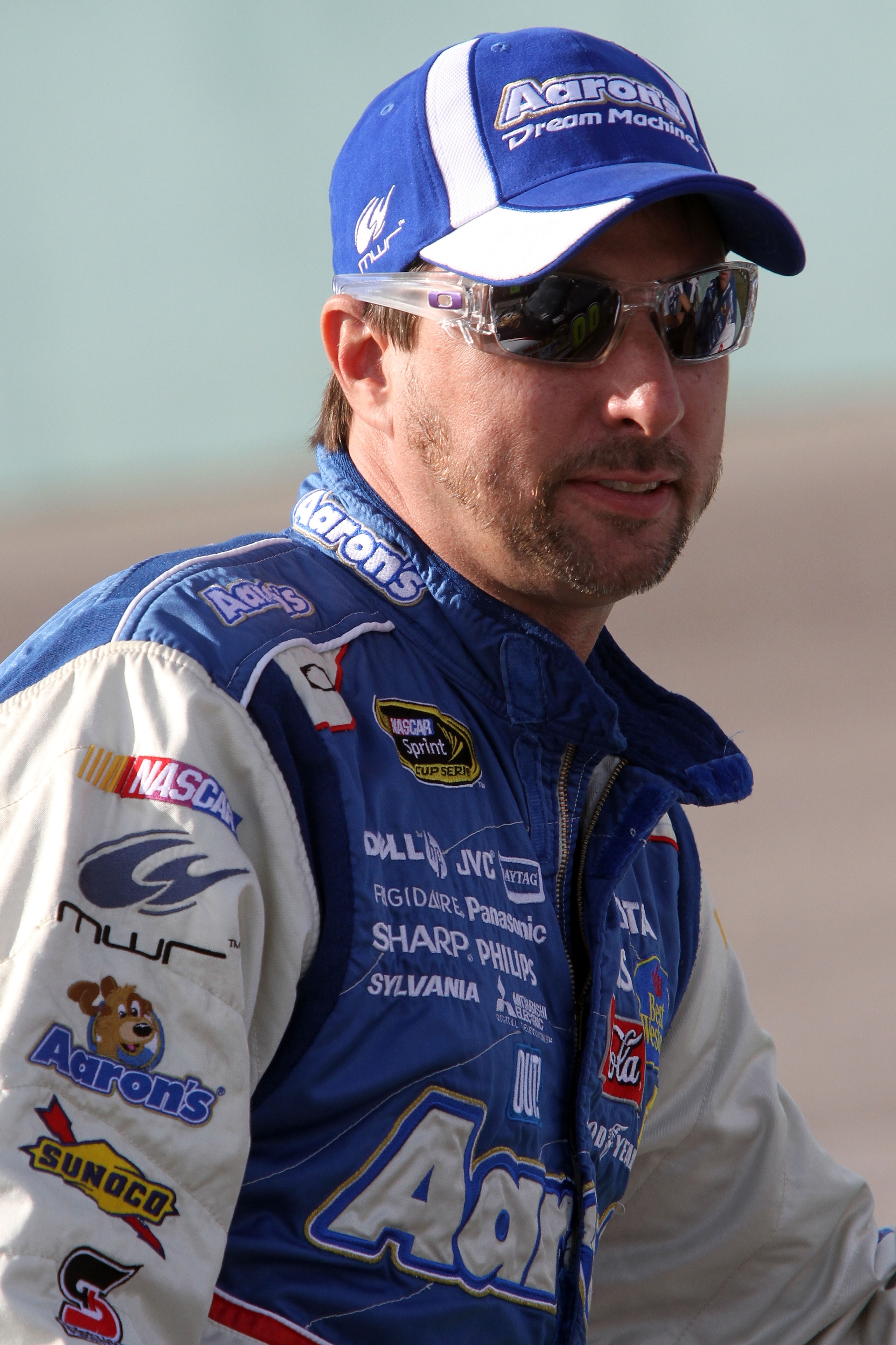 HOMESTEAD, FL - NOVEMBER 19:  David Reutimann, driver of the #00 Aaron's Dream Machine Toyota, sits on pit road wall during qualifying for the NASCAR Sprint Cup Series Ford 400 at Homestead-Miami Speedway on November 19, 2010 in Homestead, Florida.  (Phot