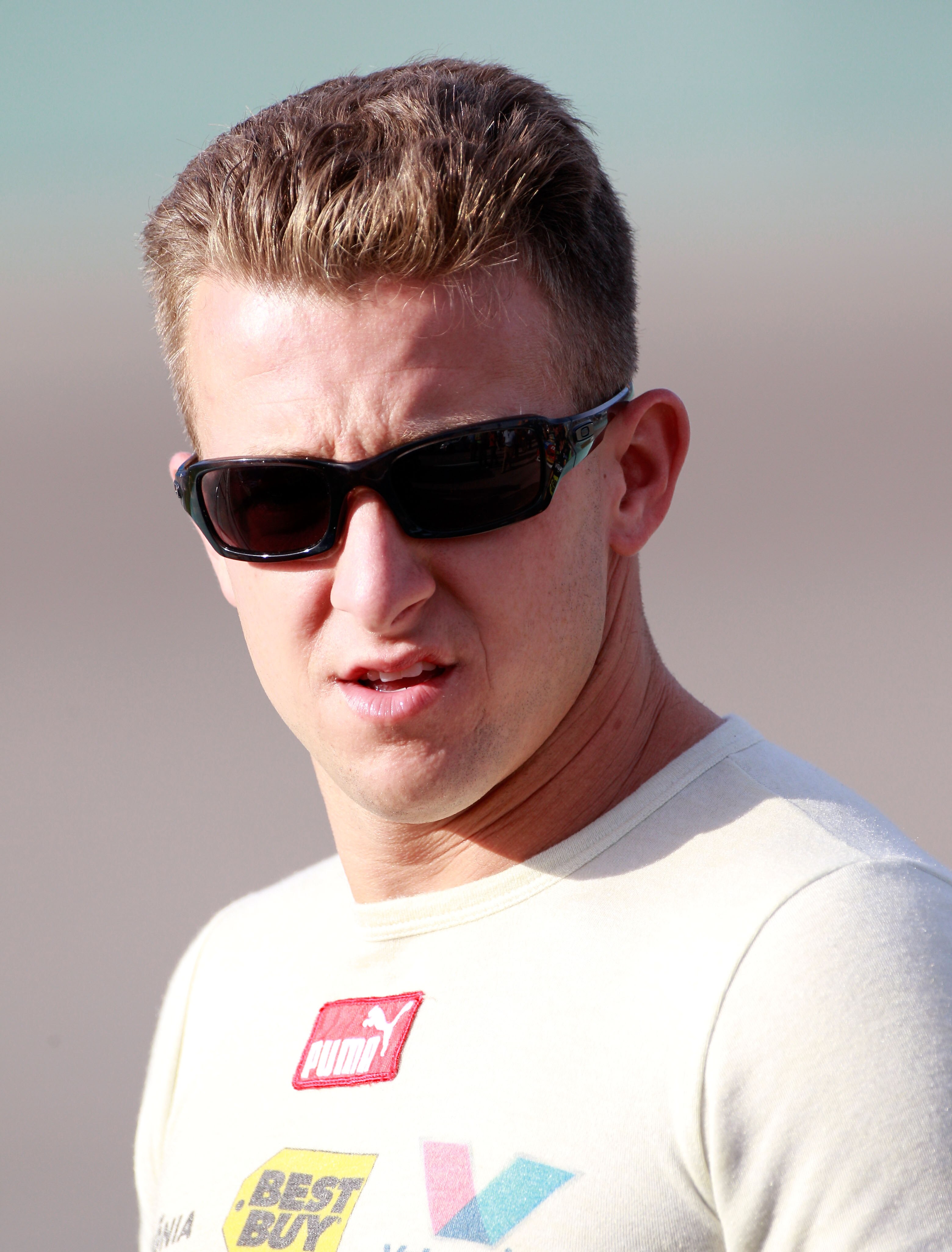 HOMESTEAD, FL - NOVEMBER 19:  A.J. Allmendinger, driver of the #43 Insignia HDTV Ford, stands on pit road during qualifying for the NASCAR Sprint Cup Series Ford 400 at Homestead-Miami Speedway on November 19, 2010 in Homestead, Florida.  (Photo by Sam Gr