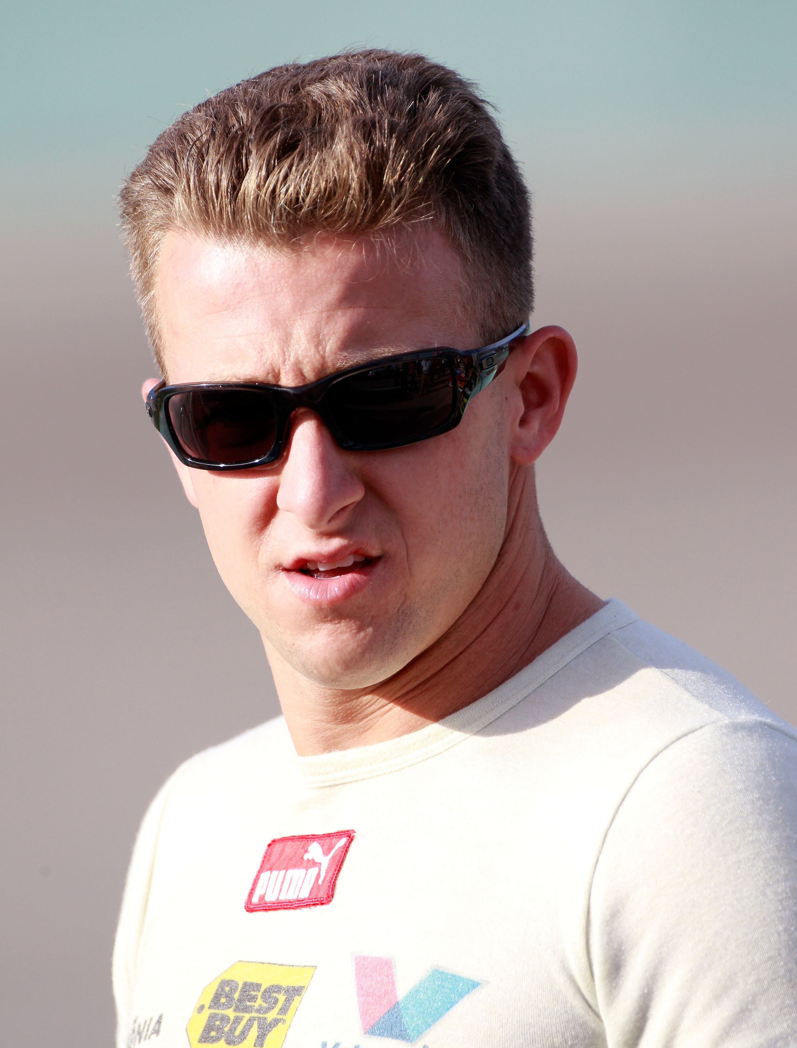 HOMESTEAD, FL - NOVEMBER 19:  A.J. Allmendinger, driver of the #43 Insignia HDTV Ford, stands on pit road during qualifying for the NASCAR Sprint Cup Series Ford 400 at Homestead-Miami Speedway on November 19, 2010 in Homestead, Florida.  (Photo by Sam Gr