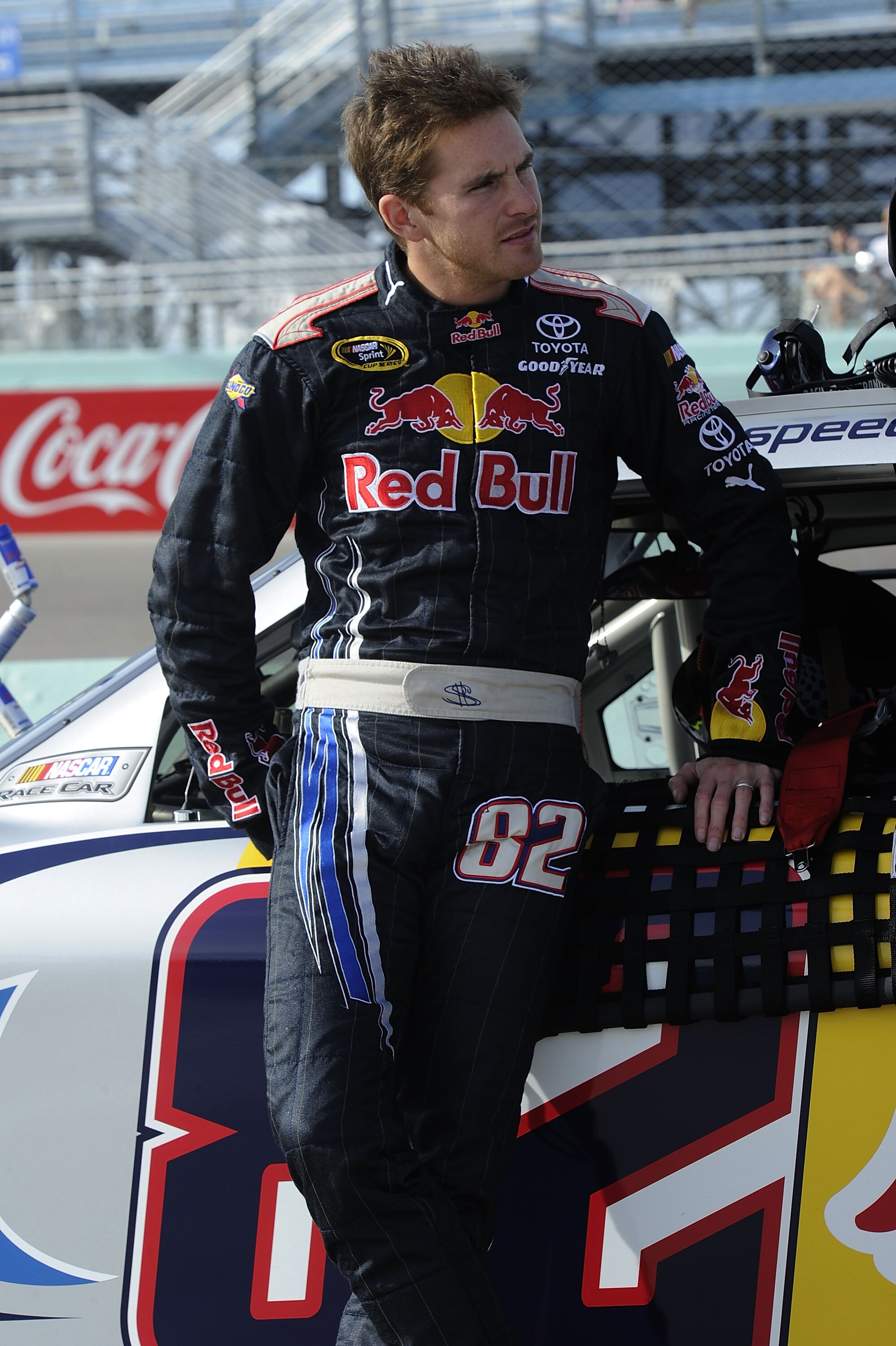 HOMESTEAD, FL - NOVEMBER 19:  Scott Speed, driver of the #82 Red Bull Toyota, leans on his car during qualifying for the NASCAR Sprint Cup Series Ford 400 at Homestead-Miami Speedway on November 19, 2010 in Homestead, Florida.  (Photo by John Harrelson/Ge