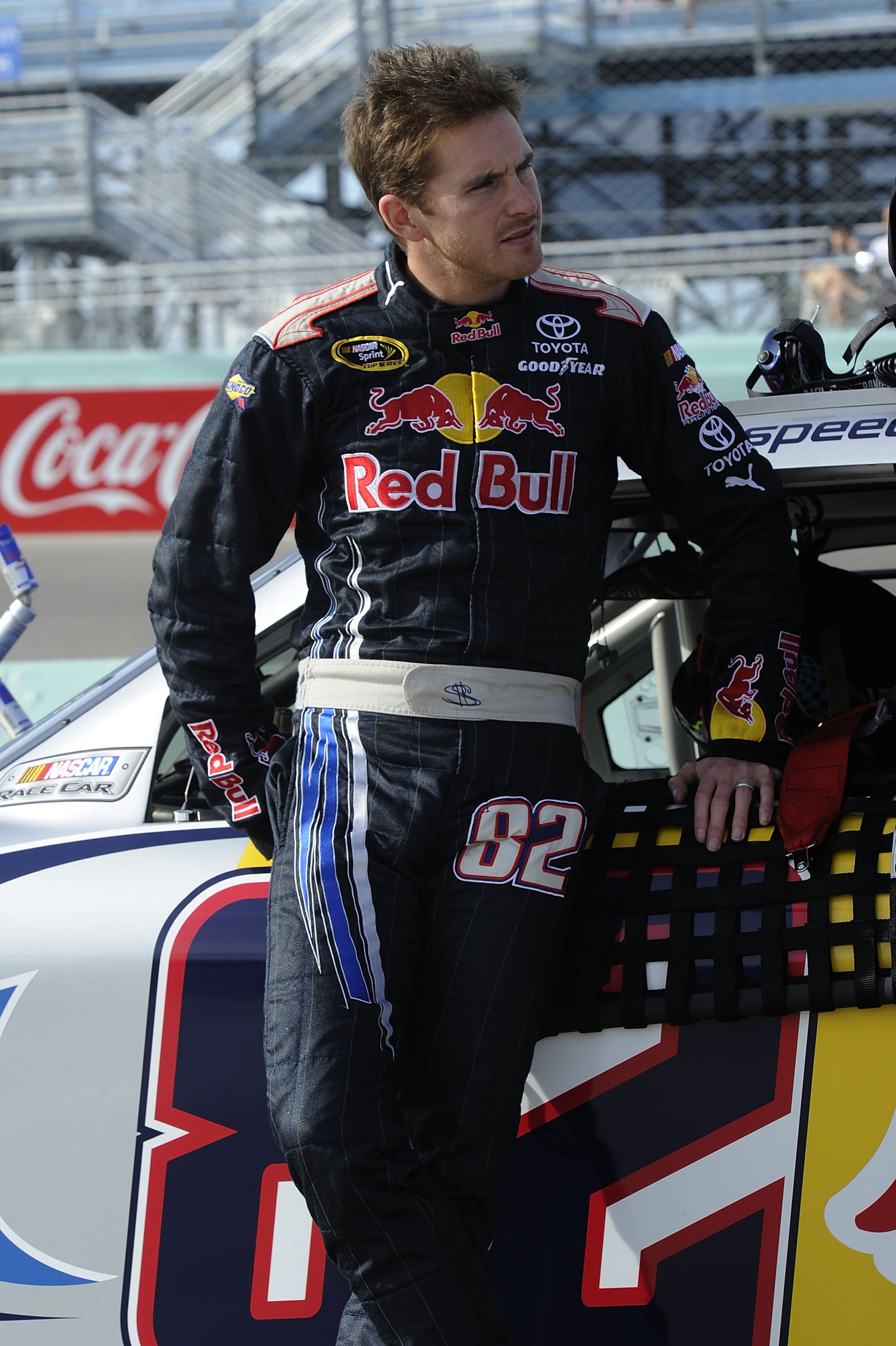 HOMESTEAD, FL - NOVEMBER 19:  Scott Speed, driver of the #82 Red Bull Toyota, leans on his car during qualifying for the NASCAR Sprint Cup Series Ford 400 at Homestead-Miami Speedway on November 19, 2010 in Homestead, Florida.  (Photo by John Harrelson/Ge