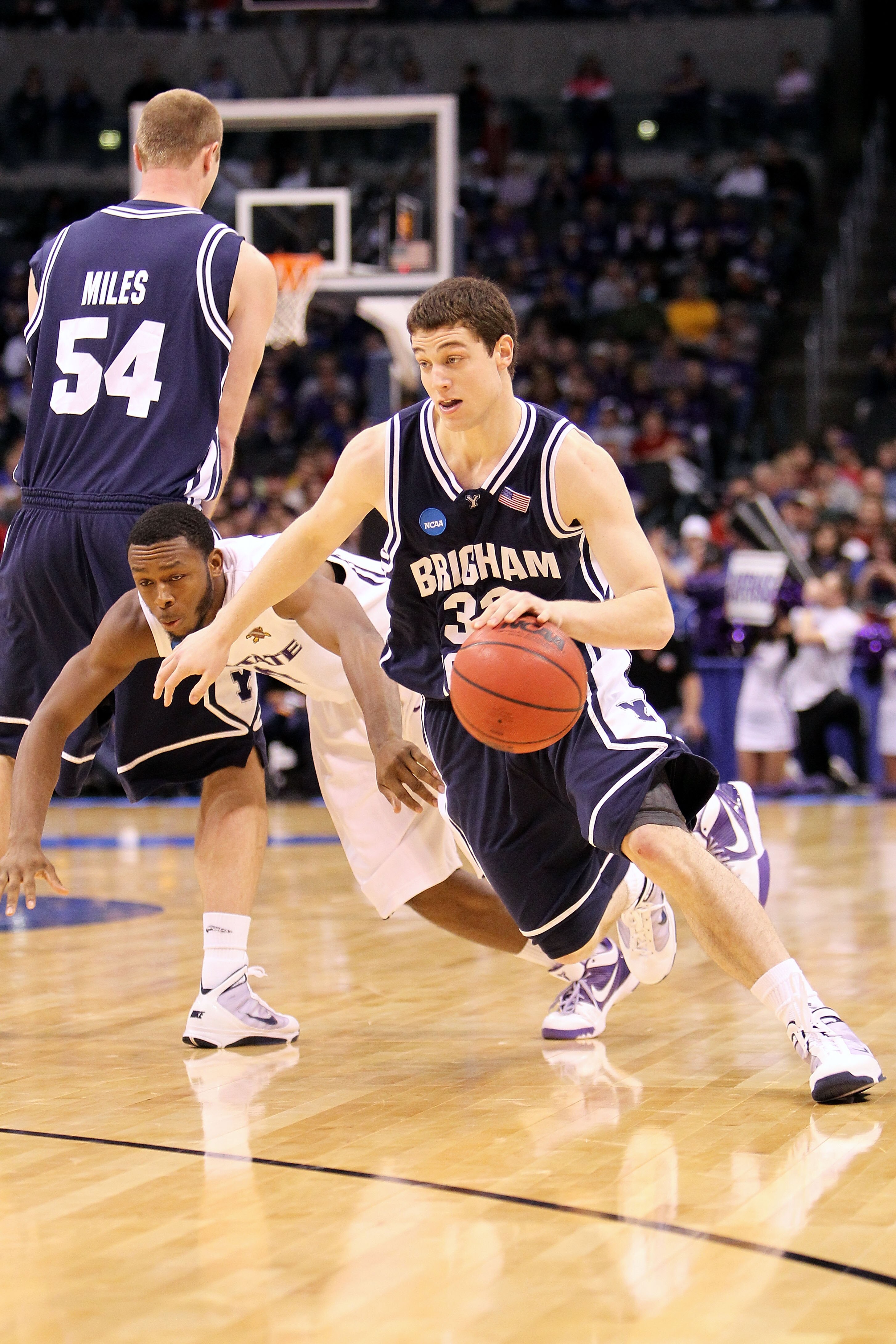 OKLAHOMA CITY - MARCH 20:  Jimmer Fredette #32 of the Brigham Young Cougars drives past Jacob Pullen #0 of the Kansas State Wildcats during the second round of the 2010 NCAA men's basketball tournament at Ford Center on March 20, 2010 in Oklahoma City, Ok