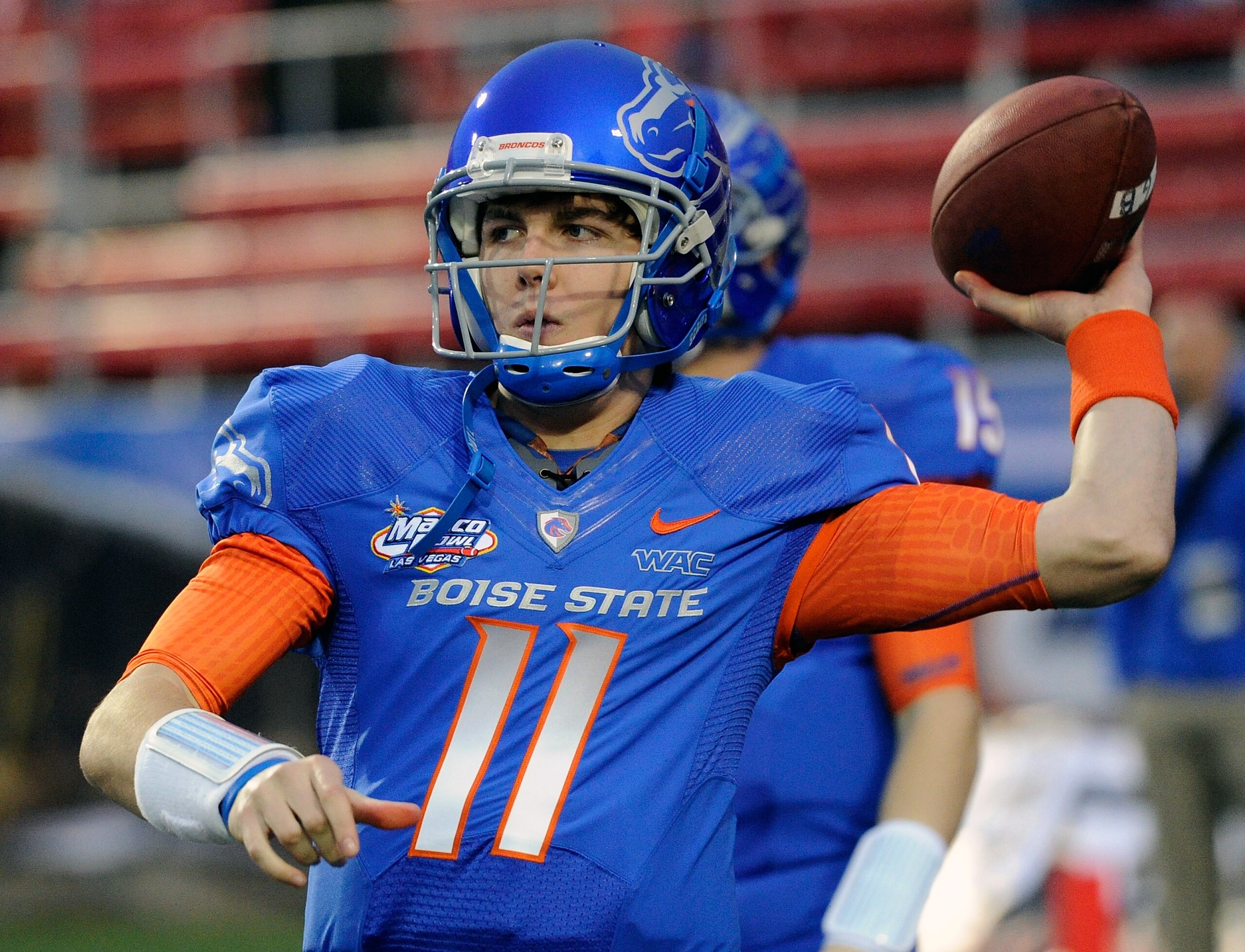 LAS VEGAS, NV - DECEMBER 22:  Quarterback Kellen Moore #11 of the Boise State Broncos warms up before playing against the Utah Utes in the MAACO Bowl Las Vegas at Sam Boyd Stadium December 22, 2010 in Las Vegas, Nevada. Boise State Won 26-3.  (Photo by Et