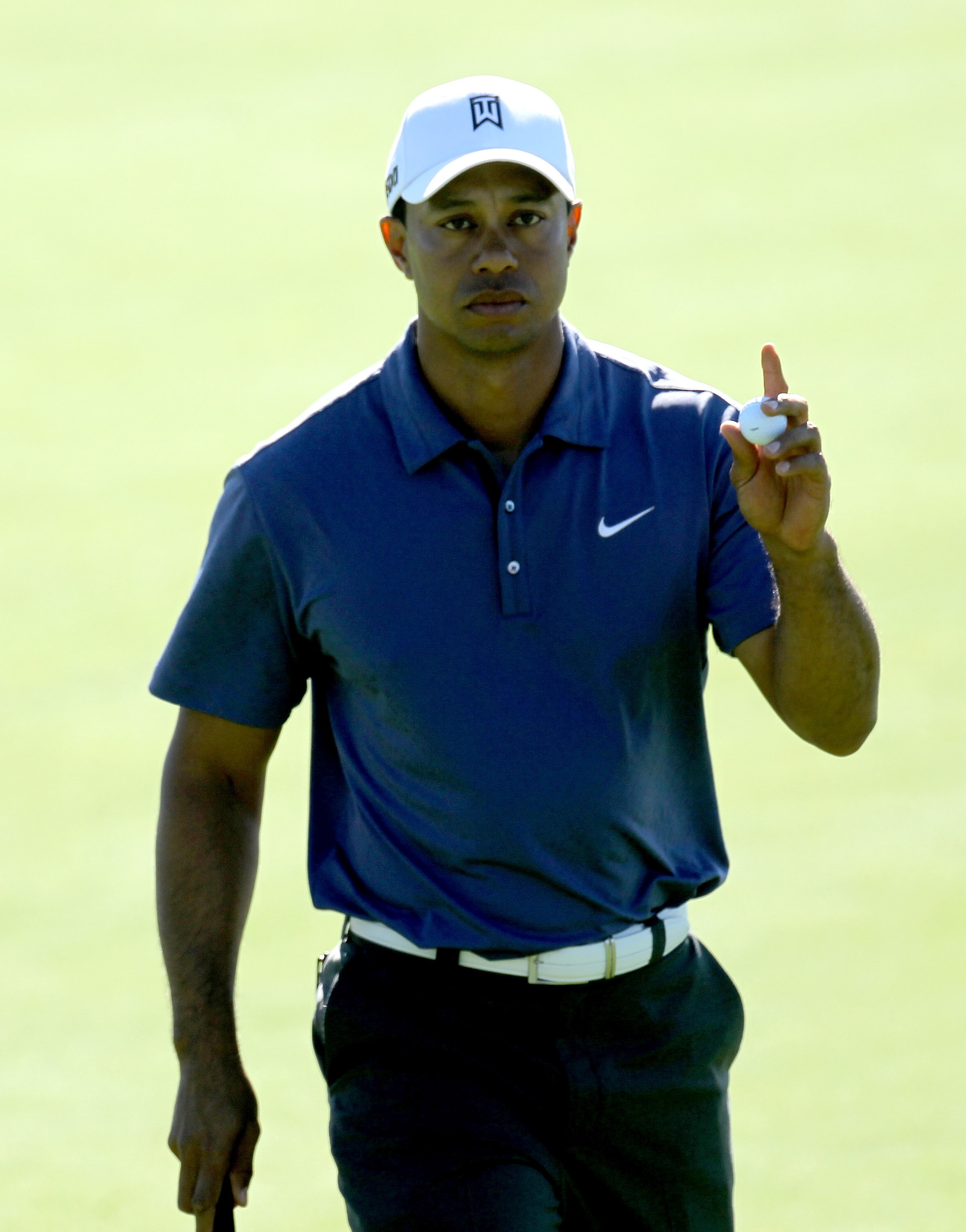 LA JOLLA, CA - JANUARY 28: Tiger Woods holds up his ball after making a birdie putt on the third hold during round two of the Farmers Insurance Open at Torrey Pines South Course on January 28, 2011 in La Jolla, California.  (Photo by Stephen Dunn/Getty Im