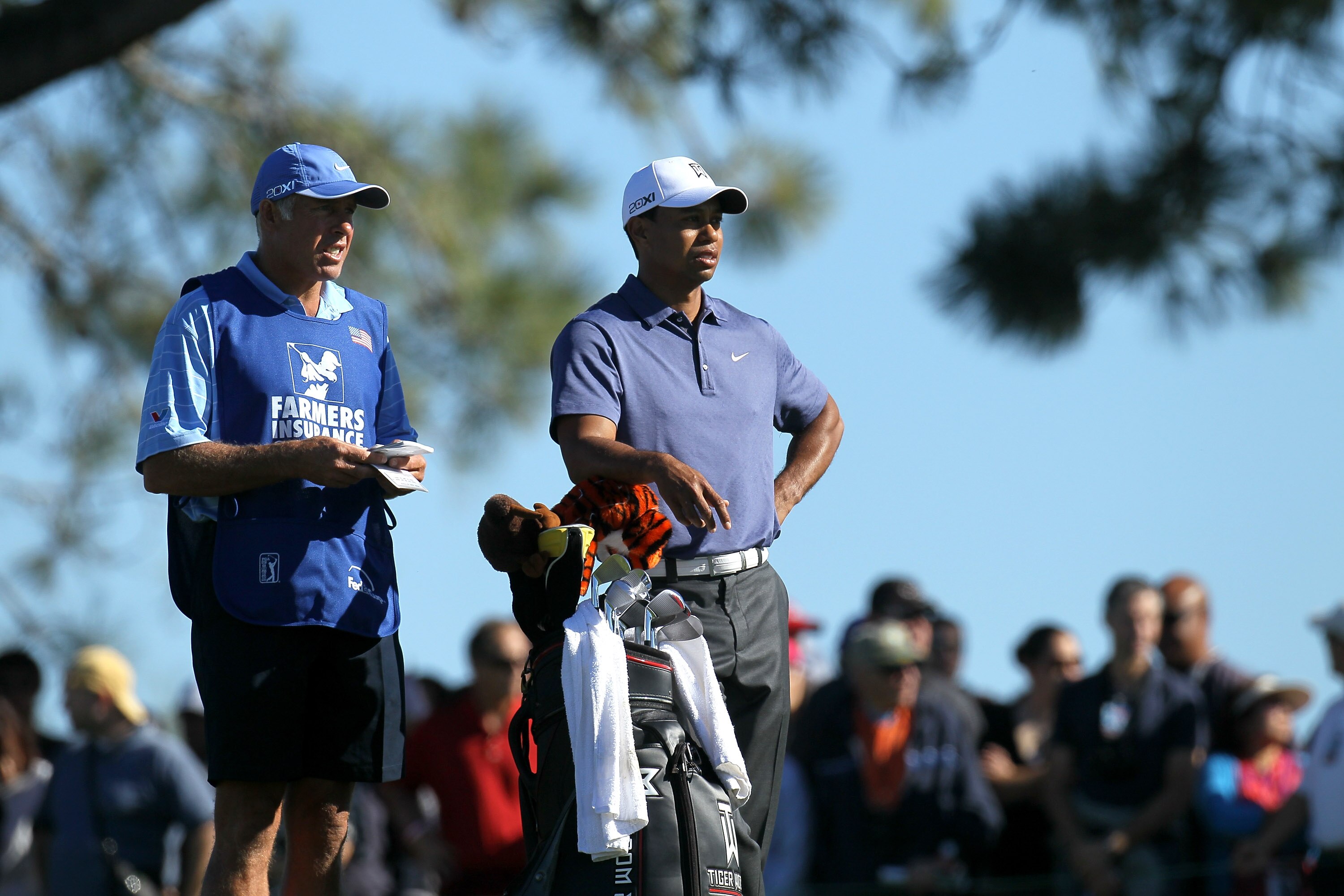 LA JOLLA, CA - JANUARY 28: Tiger Woods and caddie Steve Williams wait to hit his second shot on the second hole during round two of the Farmers Insurance Open at Torrey Pines South Course on January 28, 2011 in La Jolla, California. (Photo by Stephen Dunn