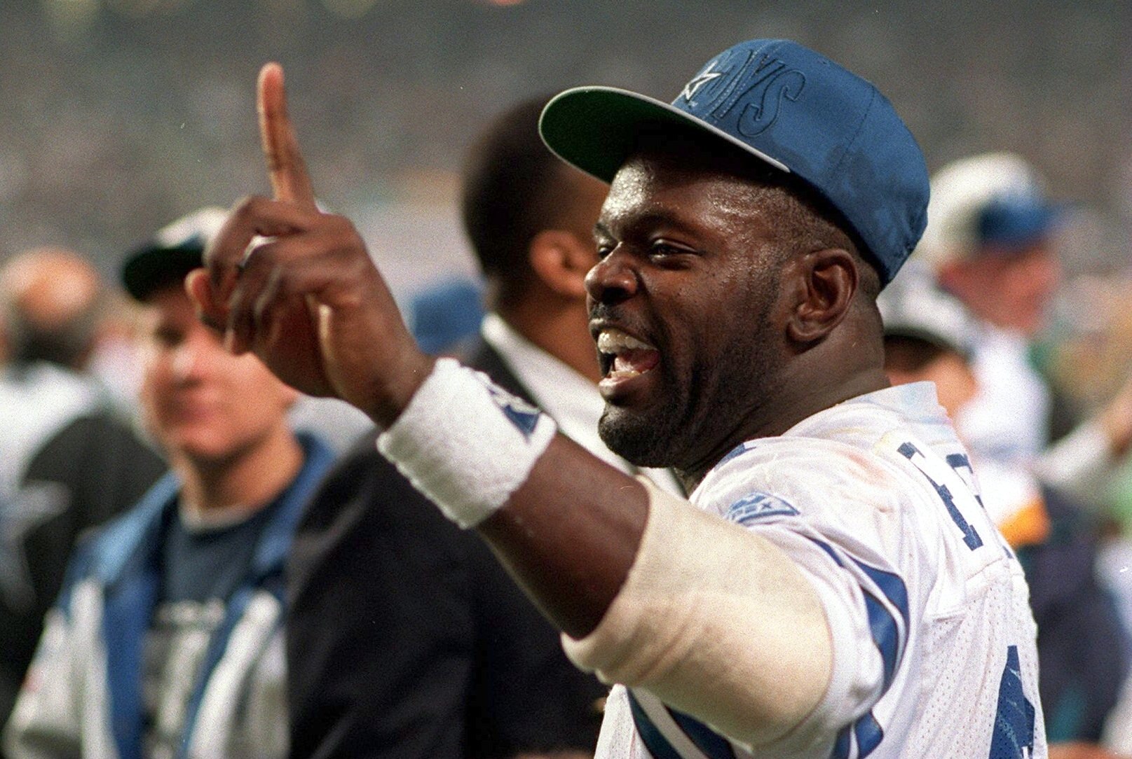 30 JAN 1994:  RUNNING BACK EMMITT SMITH OF THE DALLAS COWBOYS FLASHES THE NUMBER ONE SIGN DURING THE COWBOYS 30-13 VICTORY OVER THE BUFFALO BILLS IN SUPER BOWL XXVIII AT THE GEORGIA DOME IN ATLANTA, GEORGIA.  SMITH RUSHED FOR TWO TOUCHDOWNS AND WAS SELECT