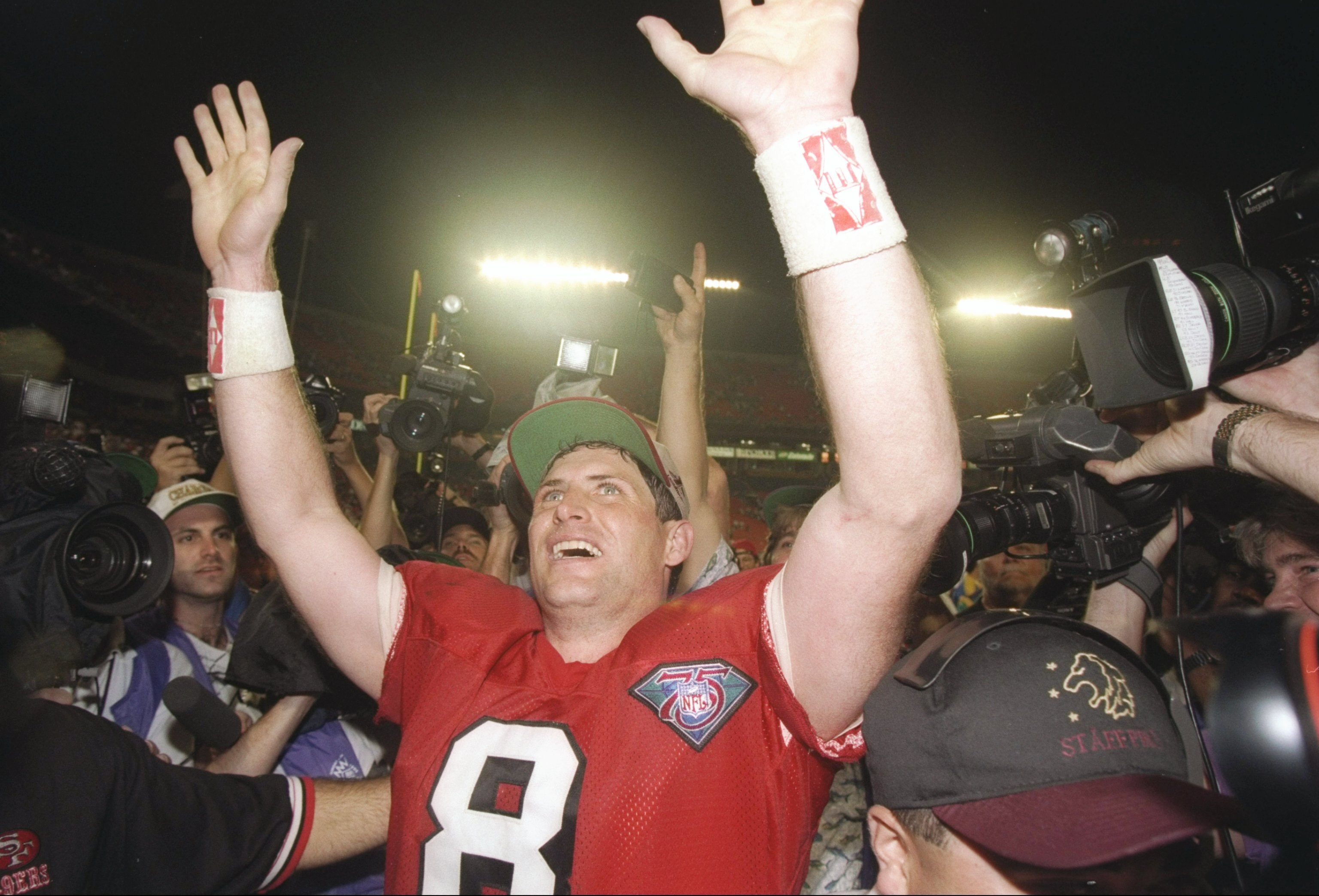 29 Jan 1995:  Quarterback Steve Young #8 of the San Francisco 49ers cheers after victory over the San Diego Chargers at Super Bowl XXIX at the Joe Robbie Stadium in Miami, Florida.  Young was named MVP and the 49ers won 49-26. Mandatory Credit: Simon Brut