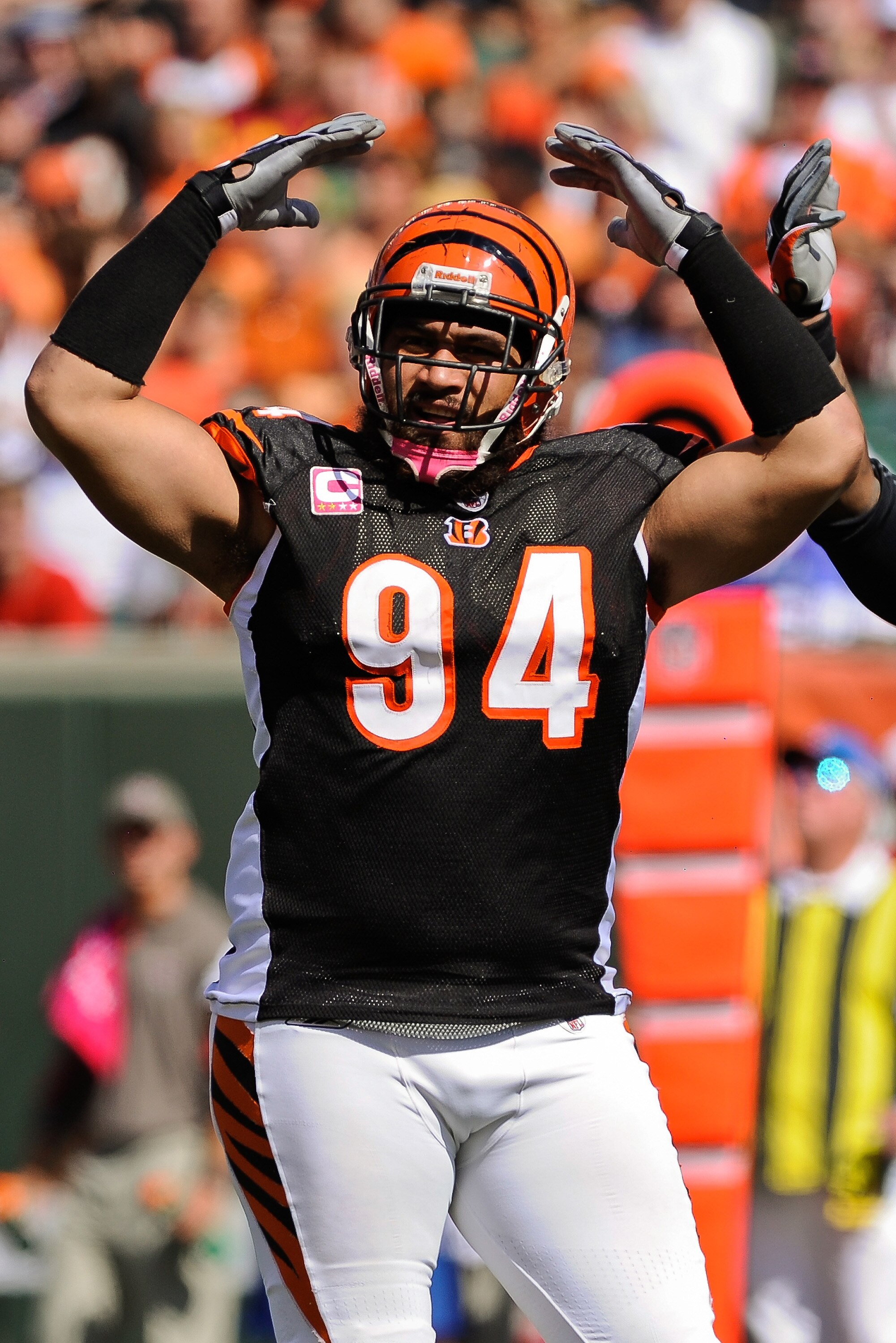CINCINNATI, OH - OCTOBER 10: Domata Peko #94 of the Cincinnati Bengals rallies the crowd during a game against the Tampa Bay Buccaneers at Paul Brown Stadium on October 10, 2010 in Cincinnati, Ohio. (Photo by Jamie Sabau/Getty Images)