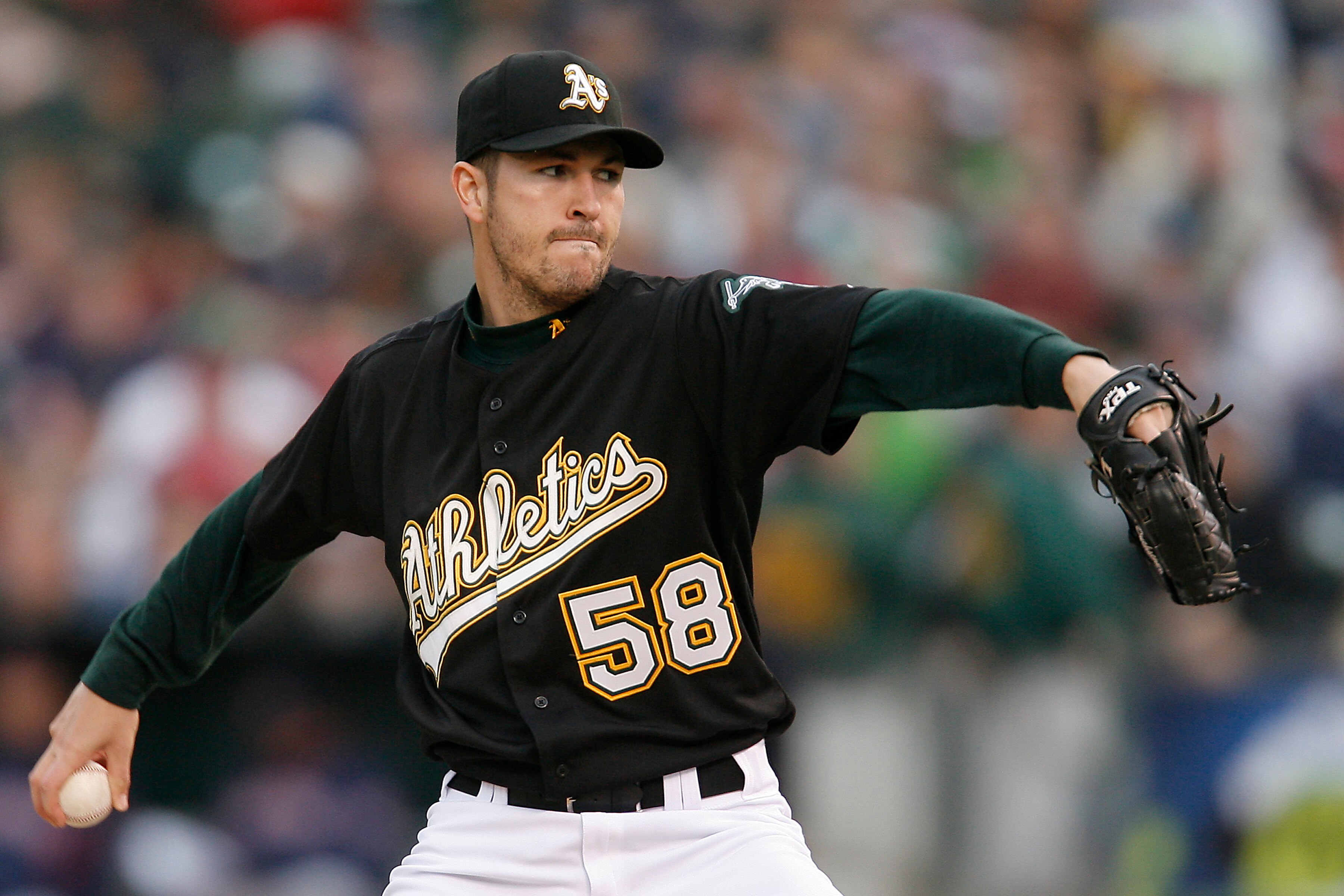 OAKLAND, CA - MAY 24:  Pitcher Justin Duchscherer #58 of the Oakland A's delivers a pitch during a game against the Boston Red Sox on May 24, 2008 at McAfee Coliseum in Oakland, California.  (Photo by Greg Trott/Getty Images)