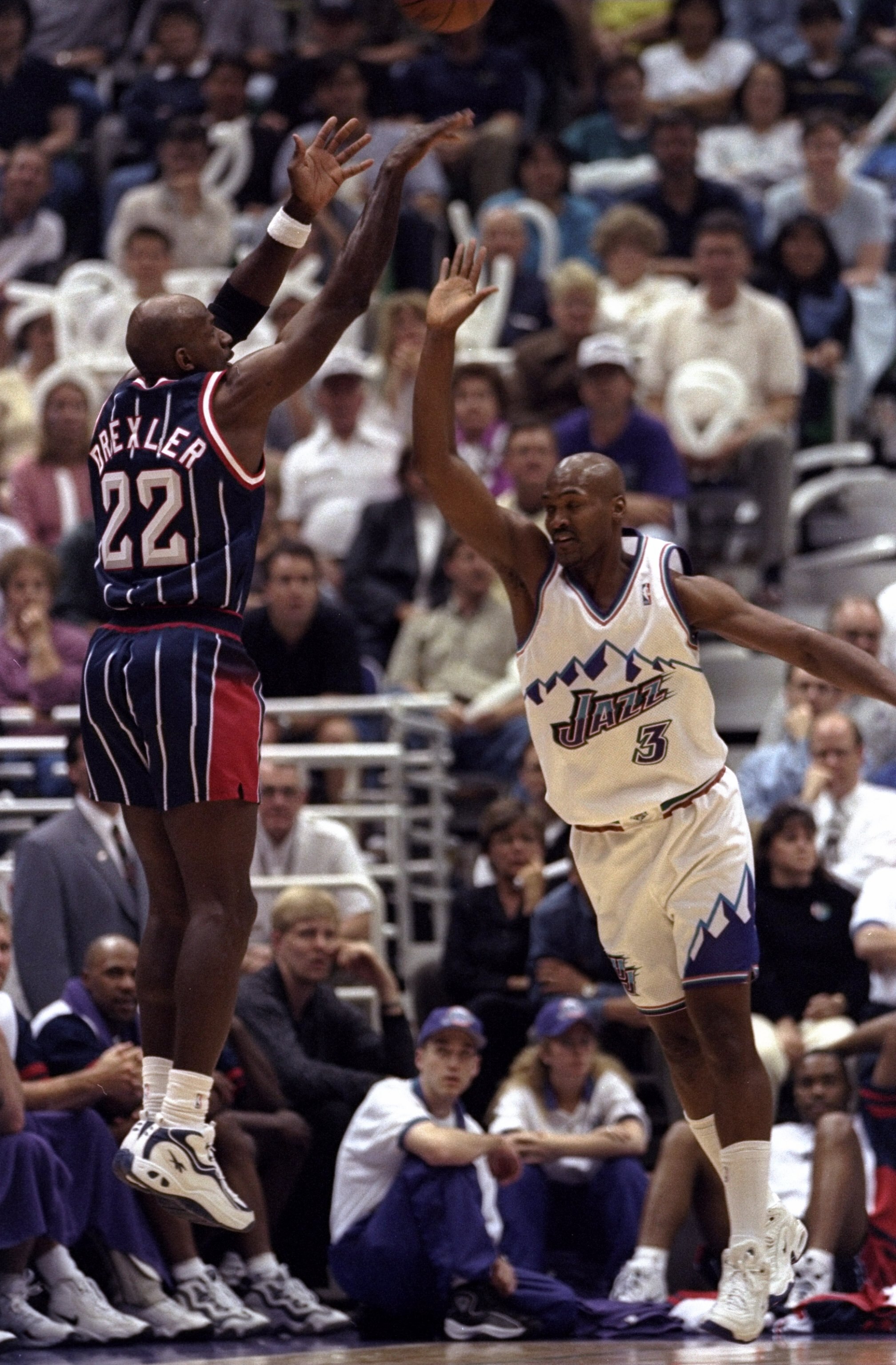 25 Apr 1998:  Guard Clyde Drexler of the Houston Rockets in action against forward Bryon Russell of the Utah Jazz during a game at the Delta Center in Salt Lake City, Utah.  The Jazz defeated the Rockets 105-90. Mandatory Credit: Otto Greule  /Allsport