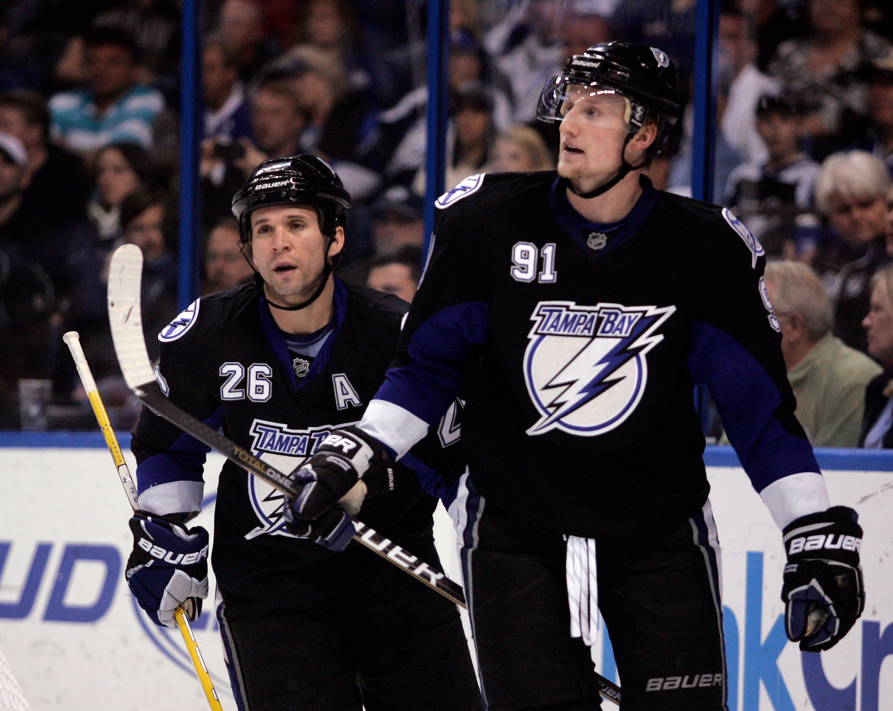 TAMPA, FL - JANUARY 25:  Steven Stamkos #91 and Martin St. Louis #26 of the Tampa Bay Lightning look on against the Toronto Maple Leafs at St. Pete Times Forum on January 25, 2011 in Tampa, Florida.  (Photo by Justin K. Aller/Getty Images)