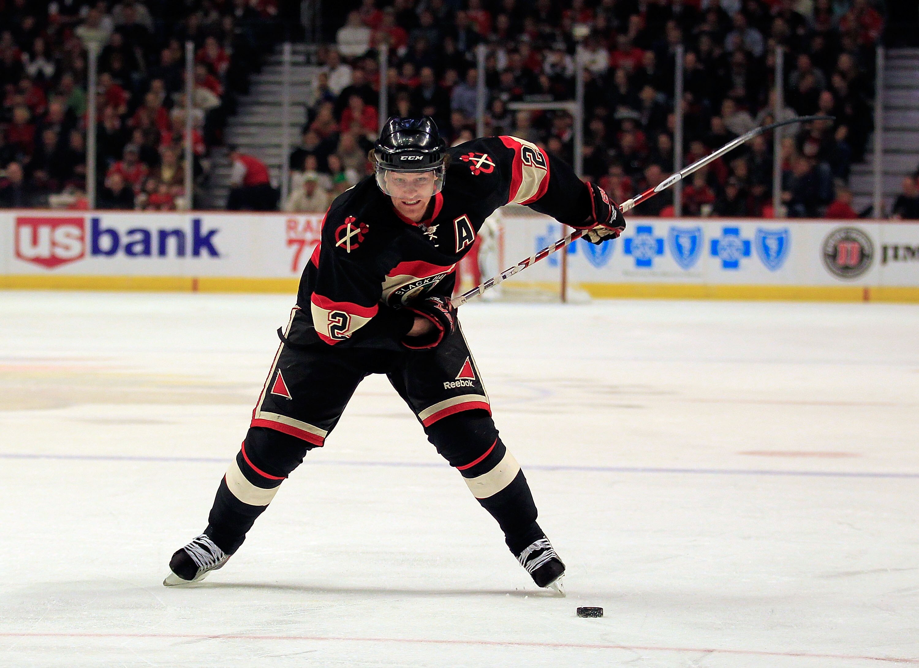 CHICAGO, IL - JANUARY 25: Duncan Keith #2 of the Chicago Blackhawks shoots the puck against the Minnesota Wild at the United Center on January 25, 2011 in Chicago, Illinois. The Wild defeated the Blackhawks 4-2. (Photo by Jonathan Daniel/Getty Images)