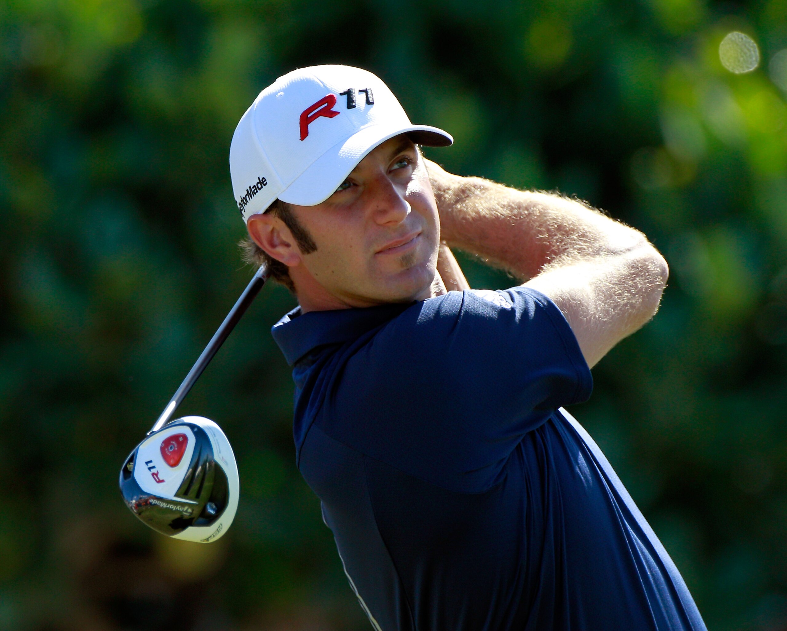 KAPALUA, HI - JANUARY 09: Dustin Johnson hits a shot during the final round of the Hyundai Tournament of Champions at the Plantation course on January 9, 2011 in Kapalua, Hawaii. (Photo by Sam Greenwood/Getty Images) KAPALUA, HI - JANUARY 09: Dustin Johnson hits a shot during the final round of the Hyundai Tournament of Champions at the Plantation course on January 9, 2011 in Kapalua, Hawaii. (Photo by Sam Greenwood/Getty Images)