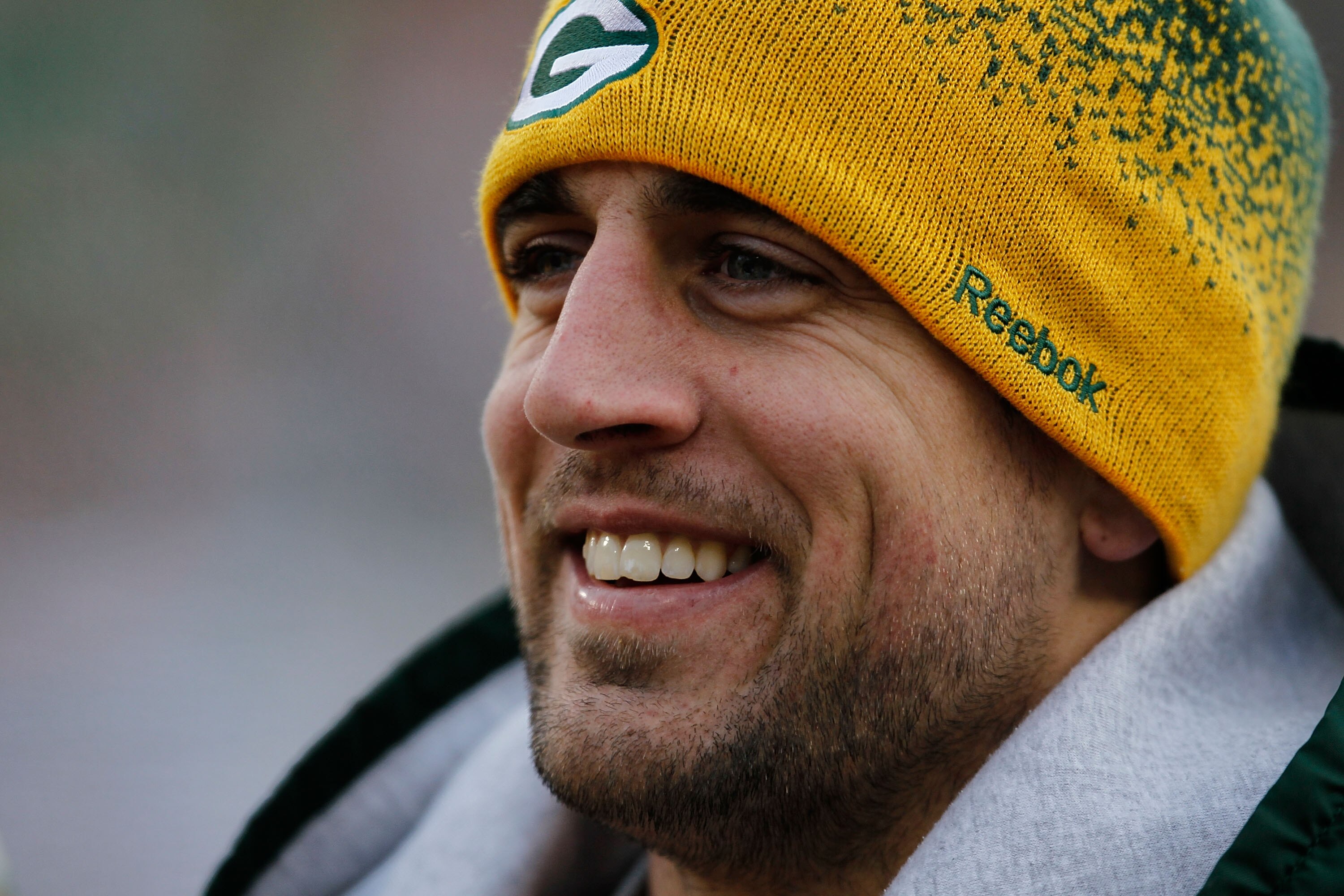 GREEN BAY, WI - DECEMBER 27: Aaron Rodgers #12 of the Green Bay Packers smiles near the end of a game against the Seattle Seahawks as the Packers clinch a wild-card playoff spot in the NFL Playoffs at Lambeau Field on December 27, 2009 in Green Bay, Wisco