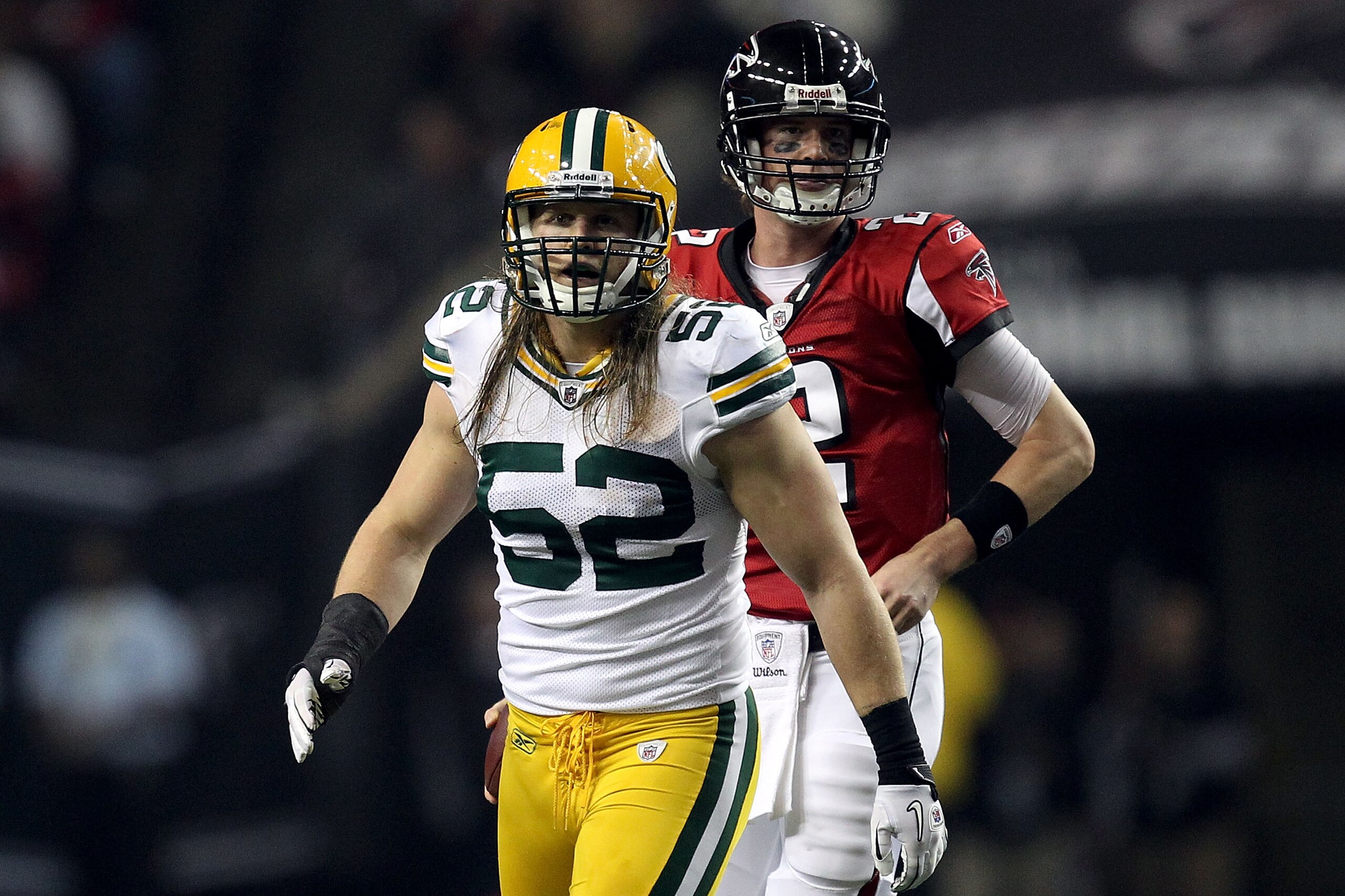 ATLANTA, GA - JANUARY 15:  Linebacker Clay Matthews #52 of the Green Bay Packers and Quarterback Matt Ryan #2 of the Atlanta Falcons look on during their 2011 NFC divisional playoff game at Georgia Dome on January 15, 2011 in Atlanta, Georgia. The Packers