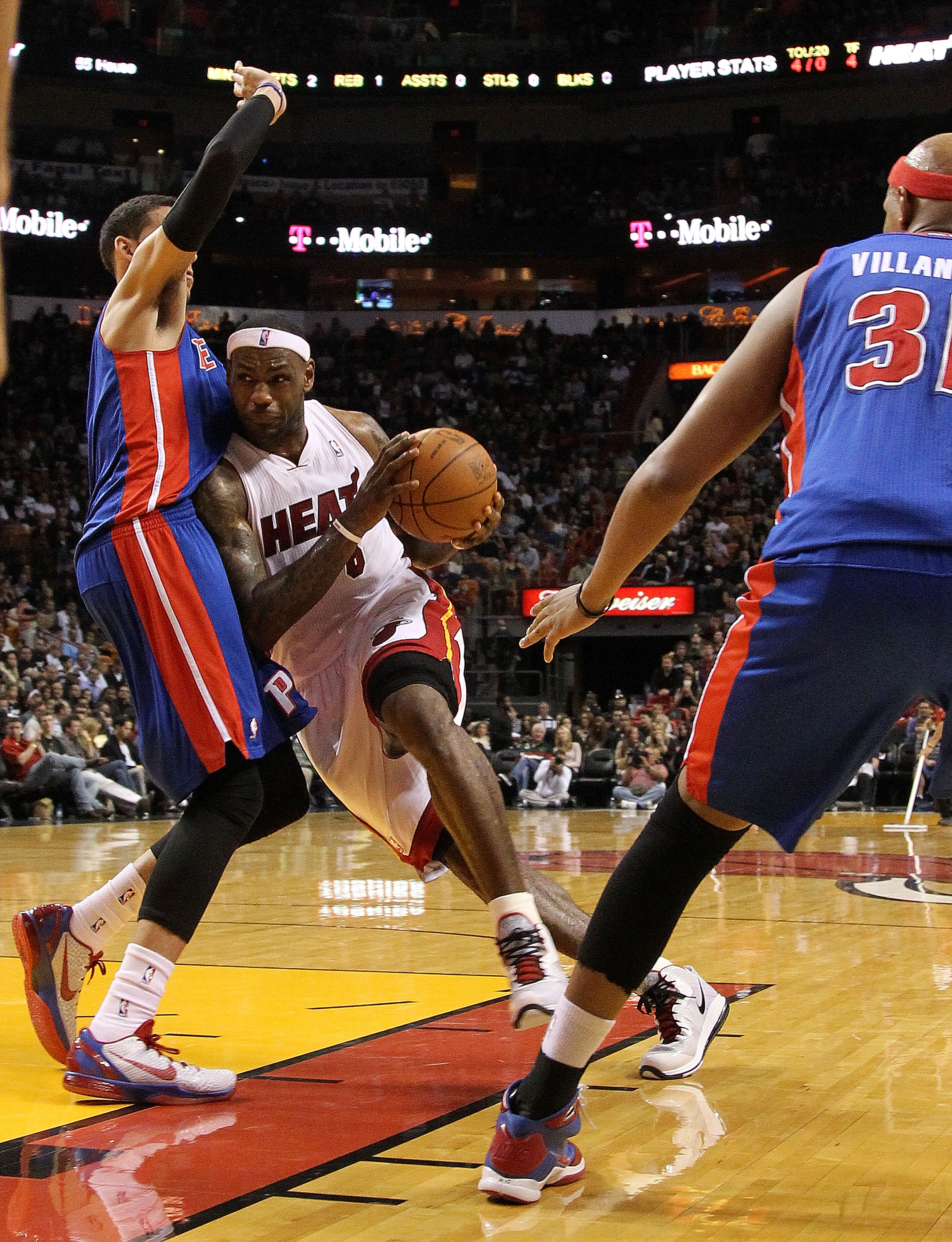 MIAMI, FL - JANUARY 28:  LeBron James #6 of the Miami Heat drives against Austin Daye #5 of the Detroit Pistons during a game at American Airlines Arena on January 28, 2011 in Miami, Florida. NOTE TO USER: User expressly acknowledges and agrees that, by d