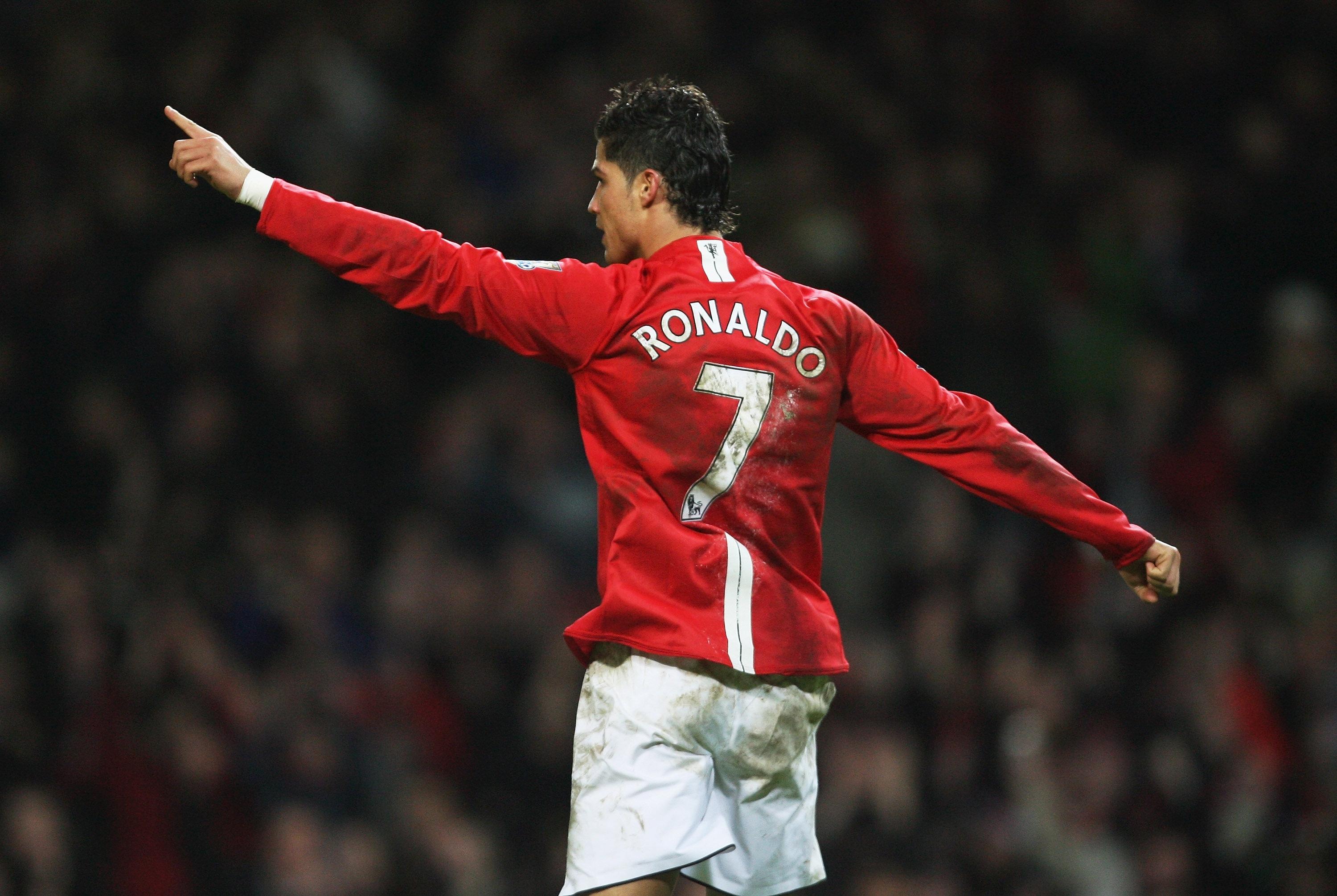 MANCHESTER, UNITED KINGDOM - JANUARY 12:  Cristiano Ronaldo of Manchester celebrates after scoring his team's third goal during the Barclays Premier League match between Manchester United and Newcastle United at Old Trafford on January 12, 2008 in Manches