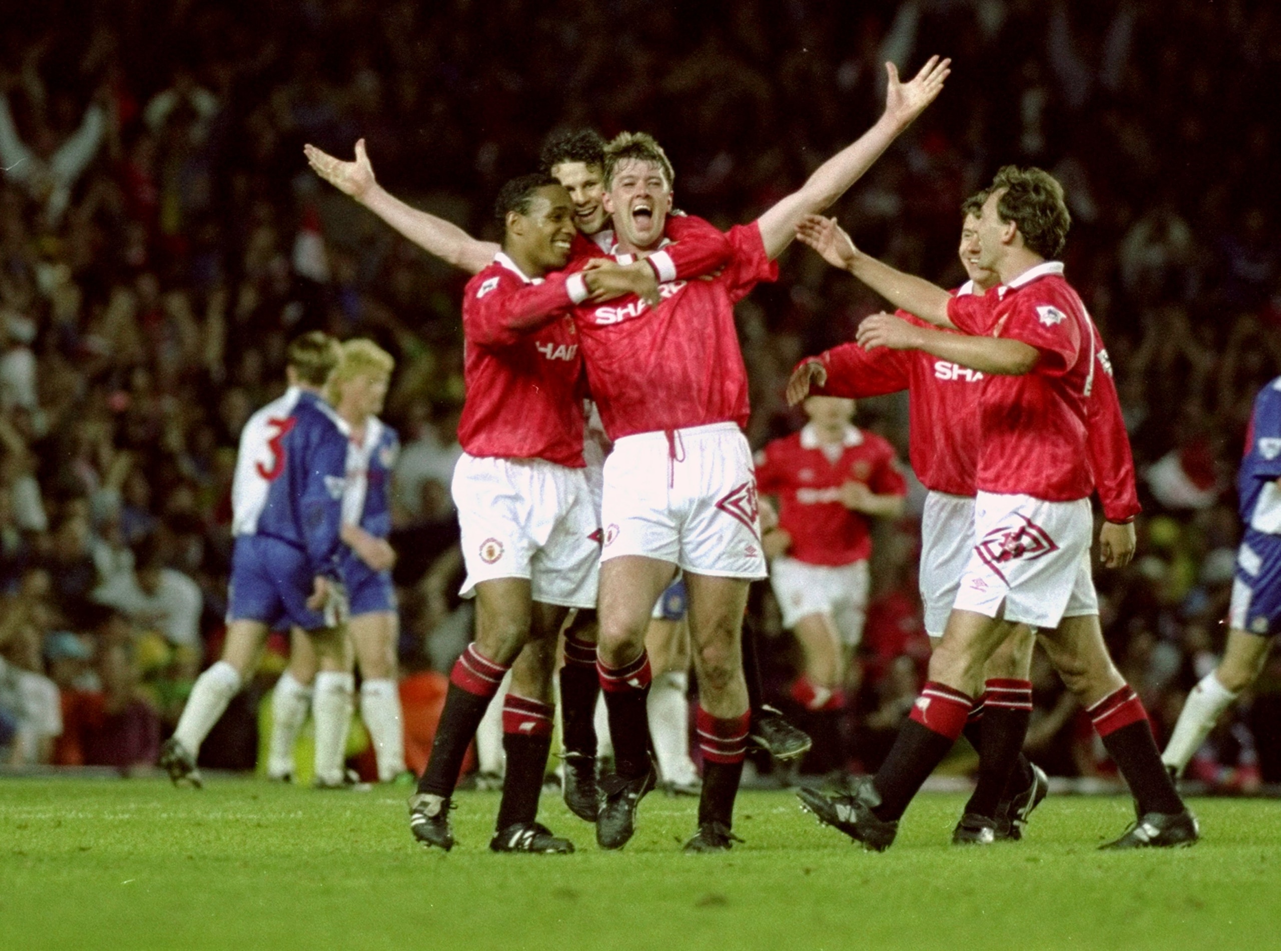 3 May 1993:  Gary Pallister of Manchester United celebrates his goal against Blackburn Rovers with team mates during the FA Carling Premier League match at Old Trafford in Manchester, England. Manchester United won 3-1 to become Premier League Champions.\