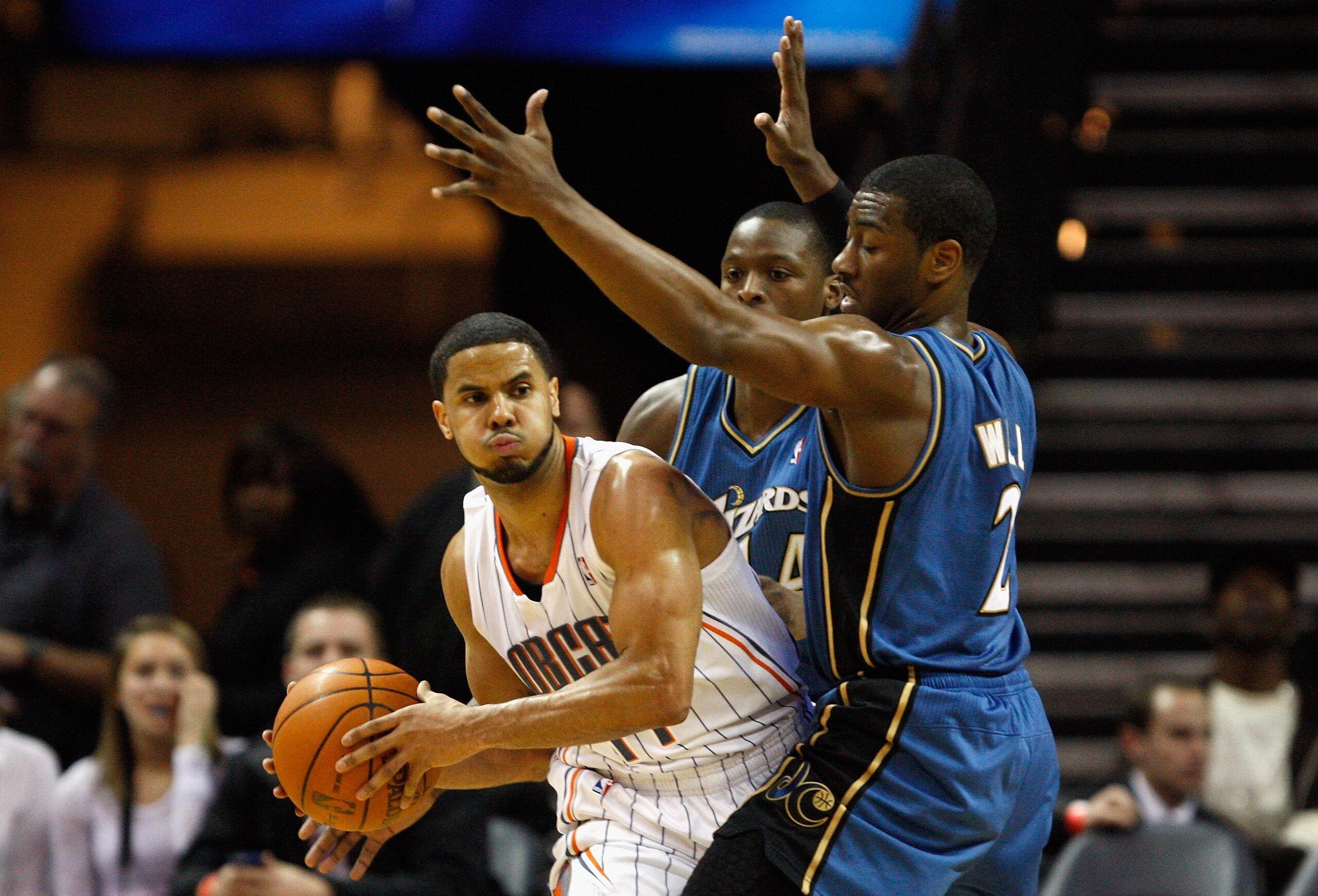 CHARLOTTE, NC - JANUARY 08:  Teammates John Wall #2 and Al Thornton #14 of the Washington Wizards trap D.J. Augustin #14 of the Charlotte Bobcats during their game at Time Warner Cable Arena on January 8, 2011 in Charlotte, North Carolina. NOTE TO USER: U
