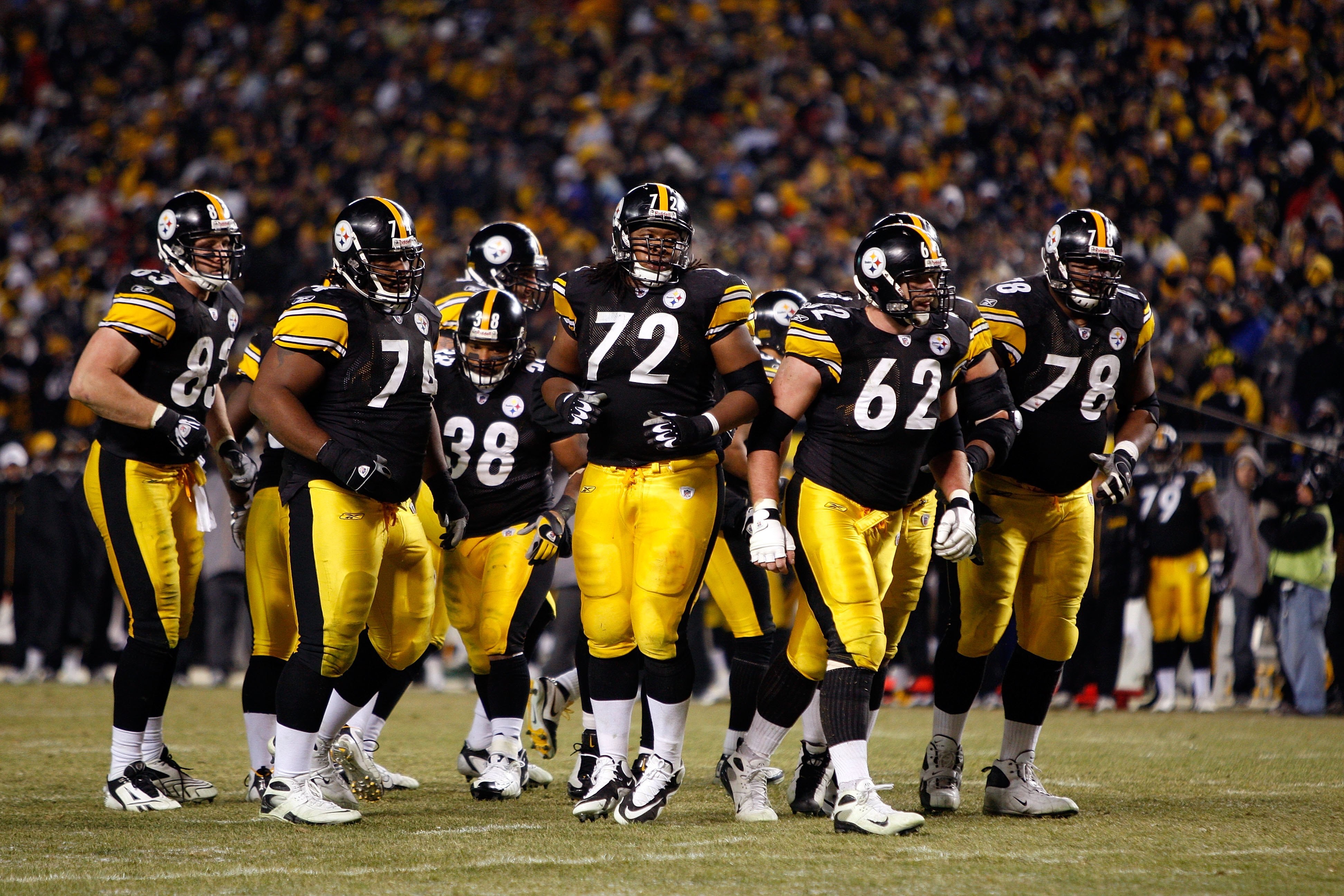 PITTSBURGH - JANUARY 11:  (L-R) Heath Miller #83, Willie Colon #74, Carey Davis, #38, Darnell Stapleton #72, Justin Hartwig #62 and Max Starks #78 of the Pittsburgh Steelers break the offensive huddle against the San Diego Chargers during their AFC Divisi