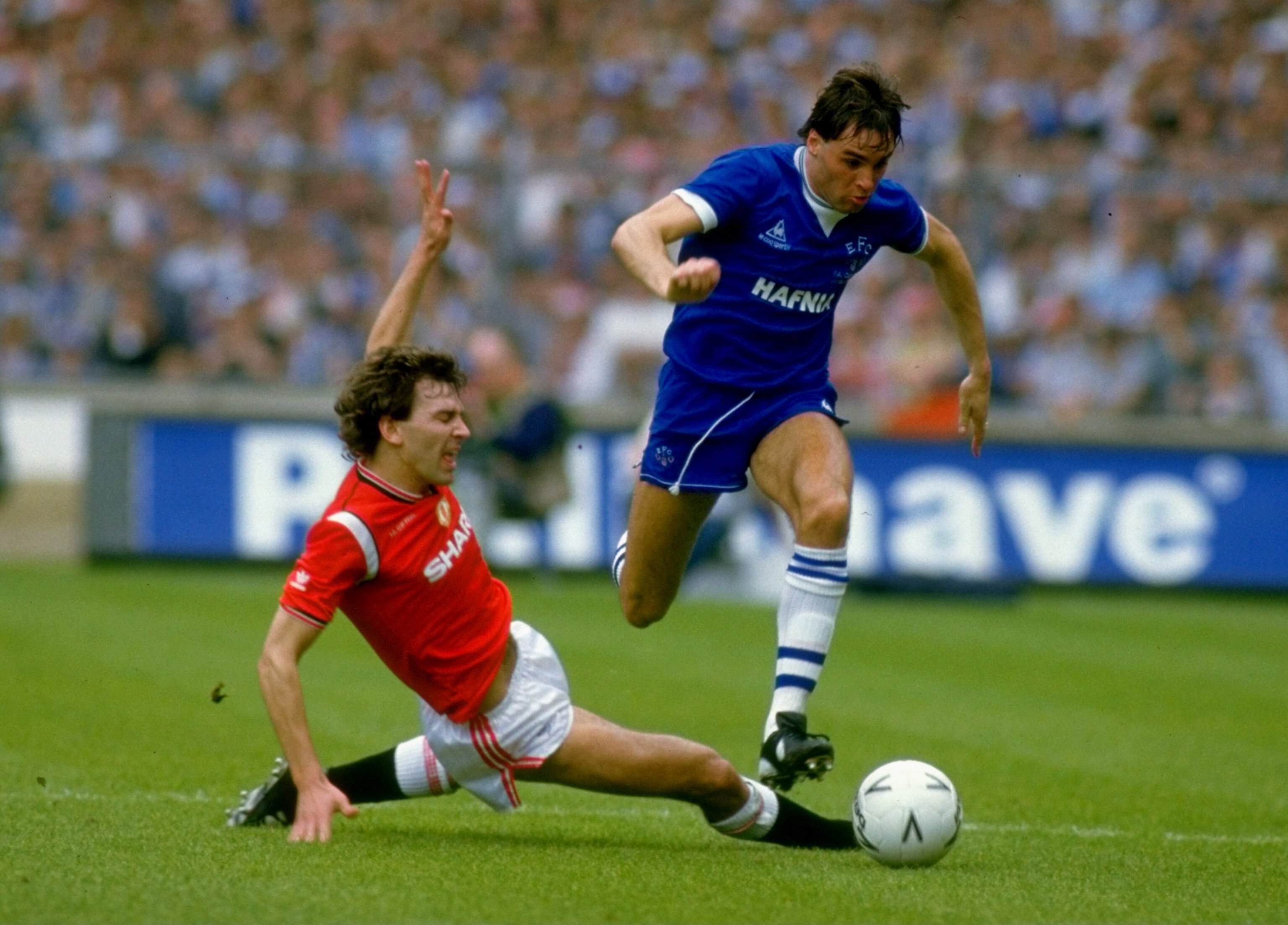 18 May 1985:  Pat Van den Hauwe of Everton goes past Bryan Robson of Manchester United during the FA Cup Final at Wembley Stadium in London. Manchester United won the match 1-0 after extra time. \ Mandatory Credit: David Cannon /Allsport